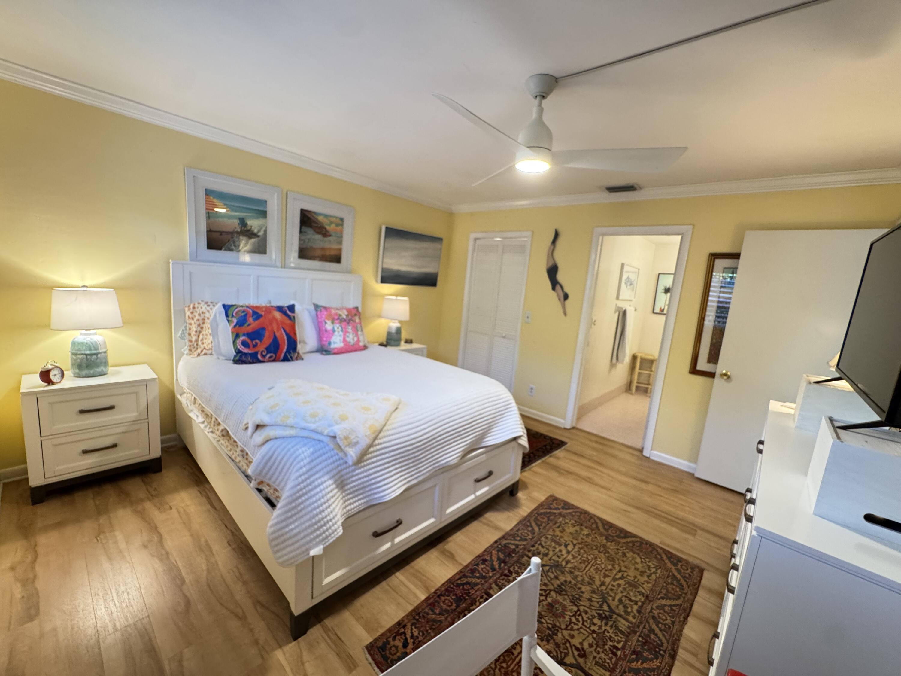 5505 North Ocean Boulevard, Unit 12103 Ocean Ridge, FL 33435 - Photo 4 of 28 a bed room with a bed and a couch