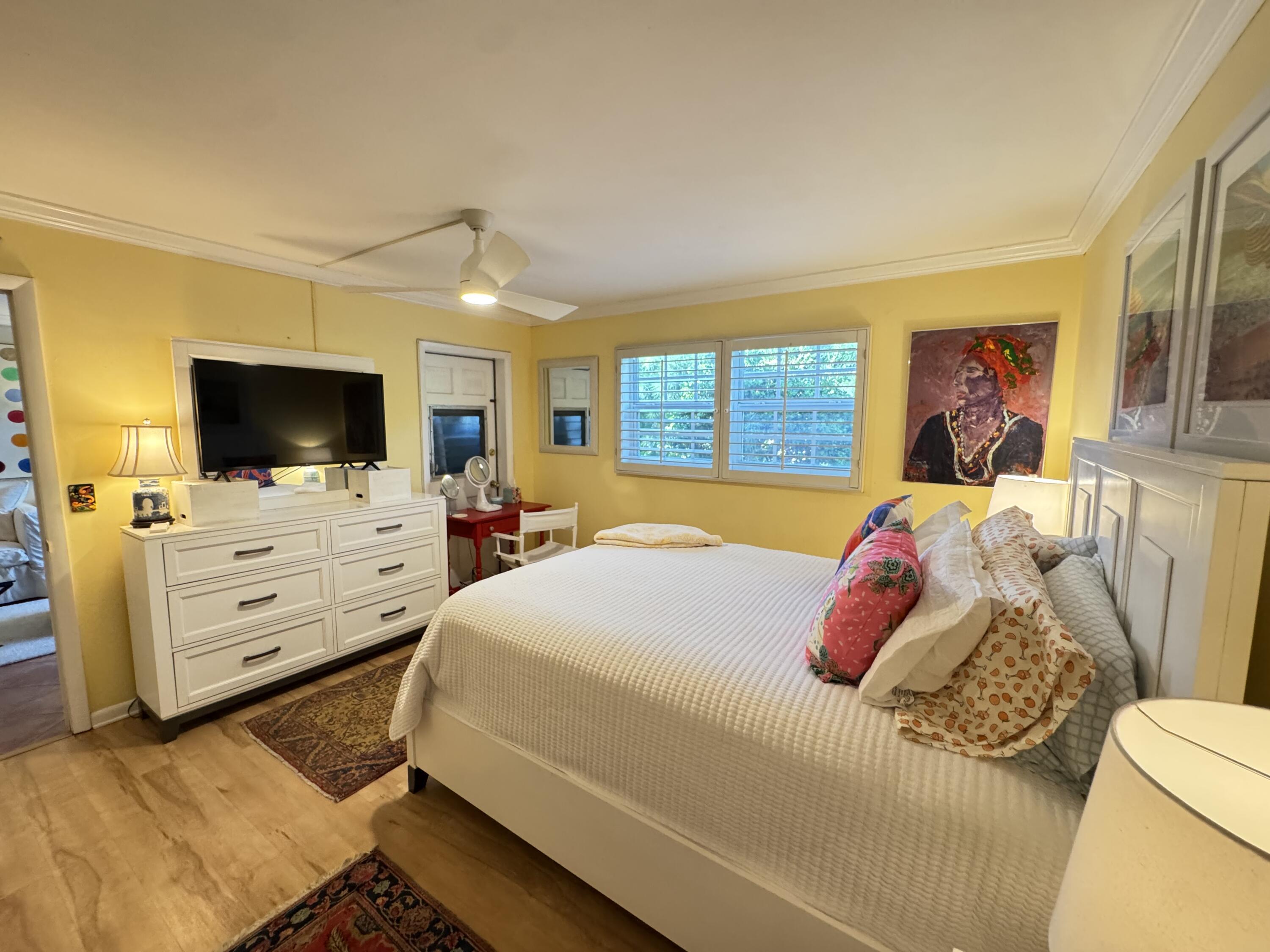 5505 North Ocean Boulevard, Unit 12103 Ocean Ridge, FL 33435 - Photo 5 of 28 a bedroom with a bed and a flat screen tv