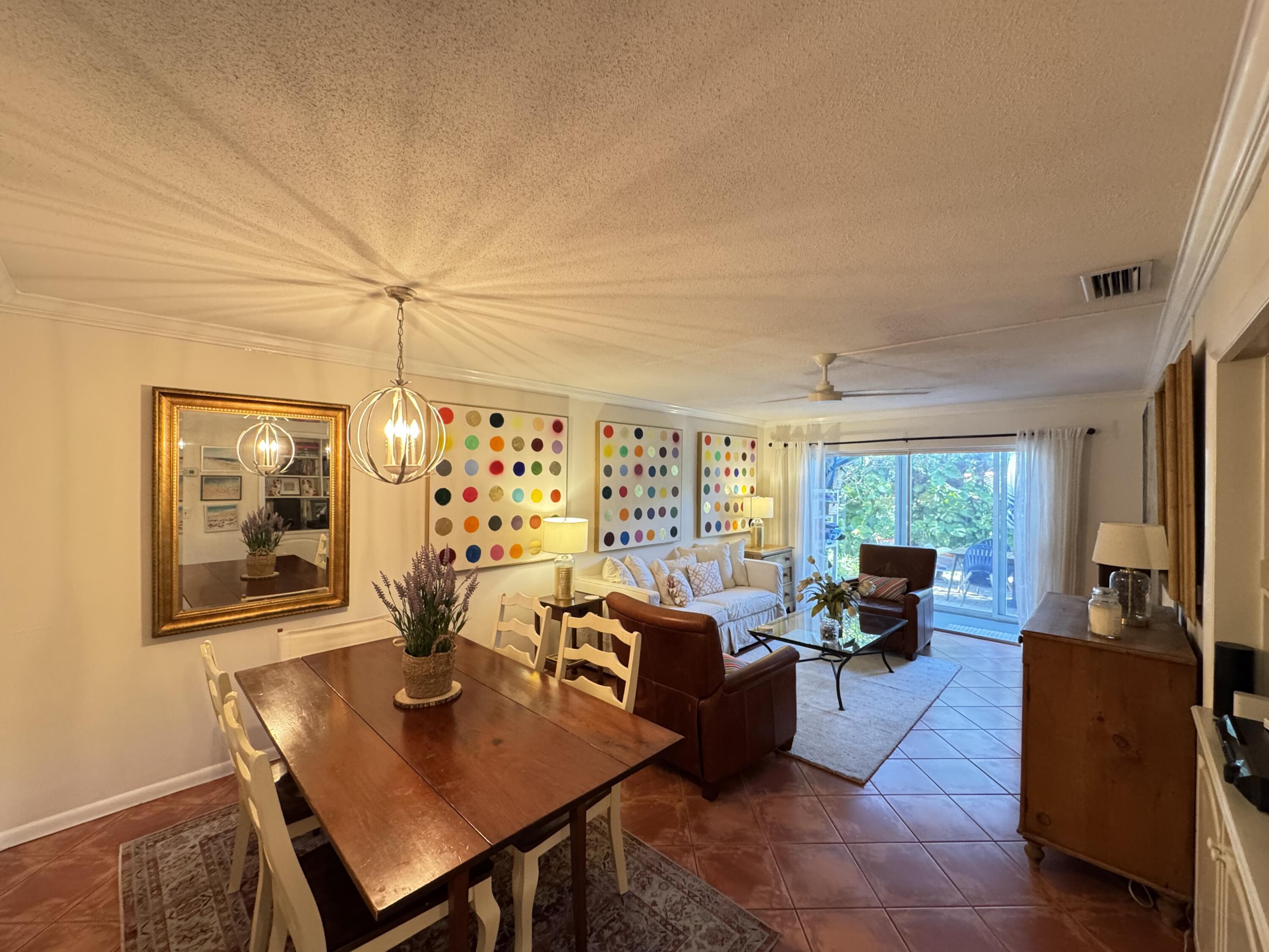 5505 North Ocean Boulevard, Unit 12103 Ocean Ridge, FL 33435 - Photo 7 of 28 a living room with fireplace furniture and a flat screen tv