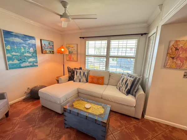 a bedroom with a bed couch and window