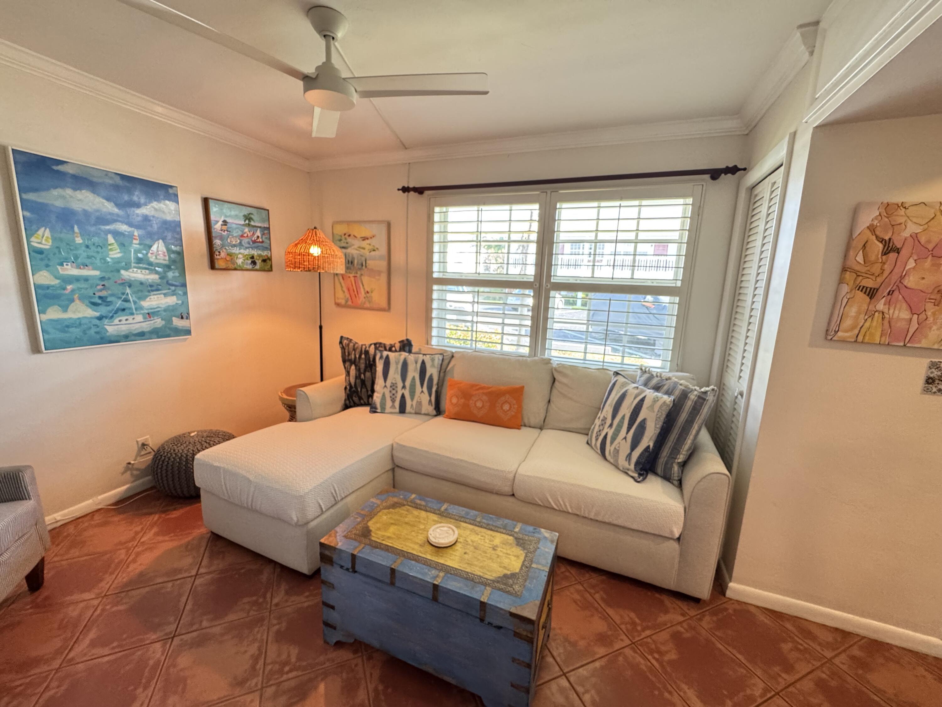 5505 North Ocean Boulevard, Unit 12103 Ocean Ridge, FL 33435 - Photo 10 of 28 a bedroom with a bed couch and window