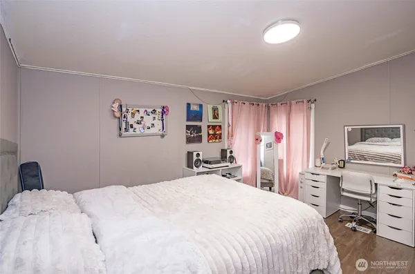 a bedroom with a bed and a closet