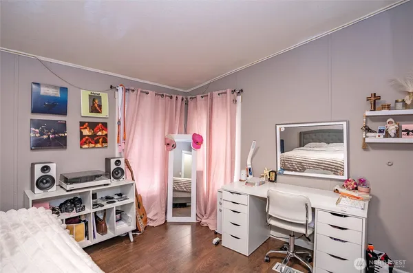 a bedroom with furniture and a window