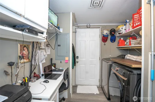 a view of a room with wooden shelves
