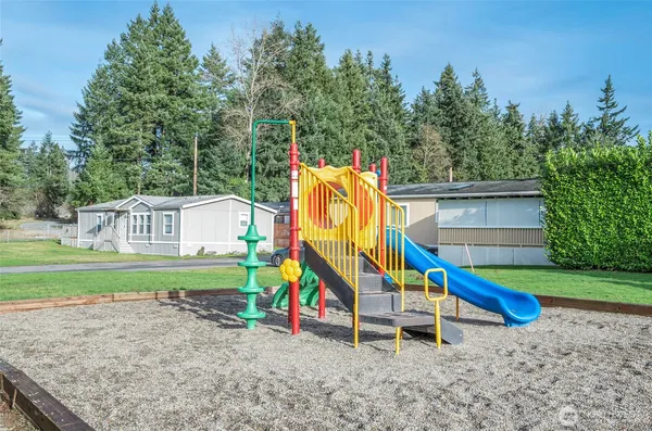 a view of outdoor space with garden and trees