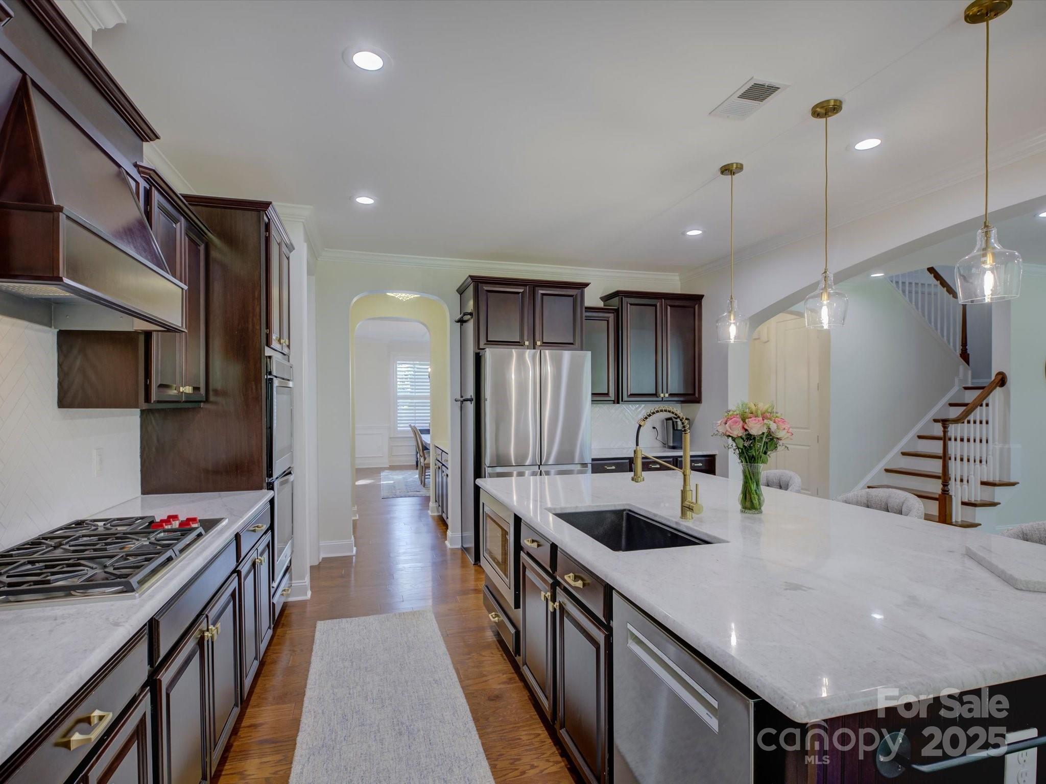 712 Chase Court Fort Mill, SC 29708 - Photo 15 of 48 a kitchen with stainless steel appliances granite countertop a sink stove and refrigerator