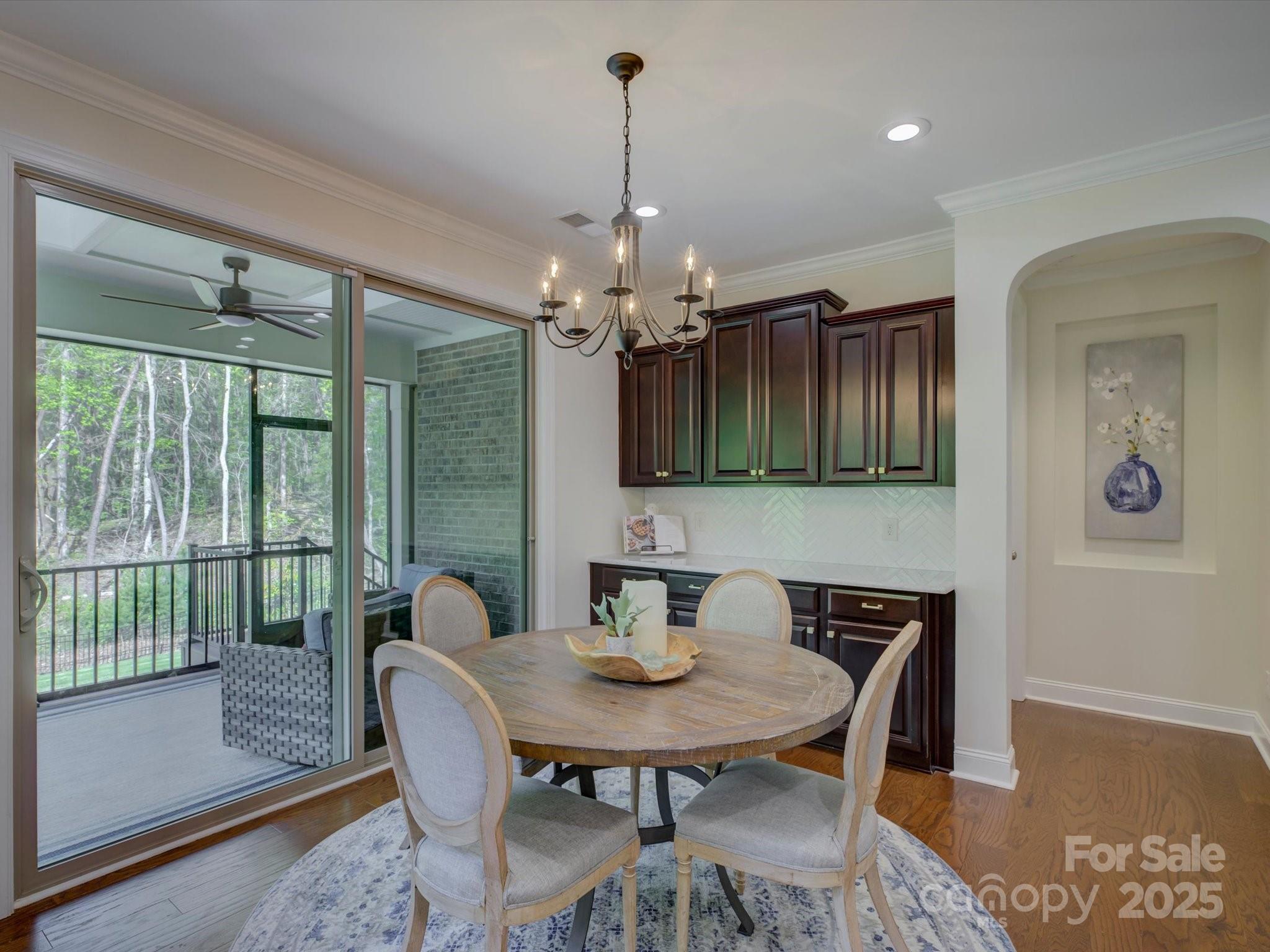 712 Chase Court Fort Mill, SC 29708 - Photo 17 of 48 a view of a dining room with furniture window and wooden floor