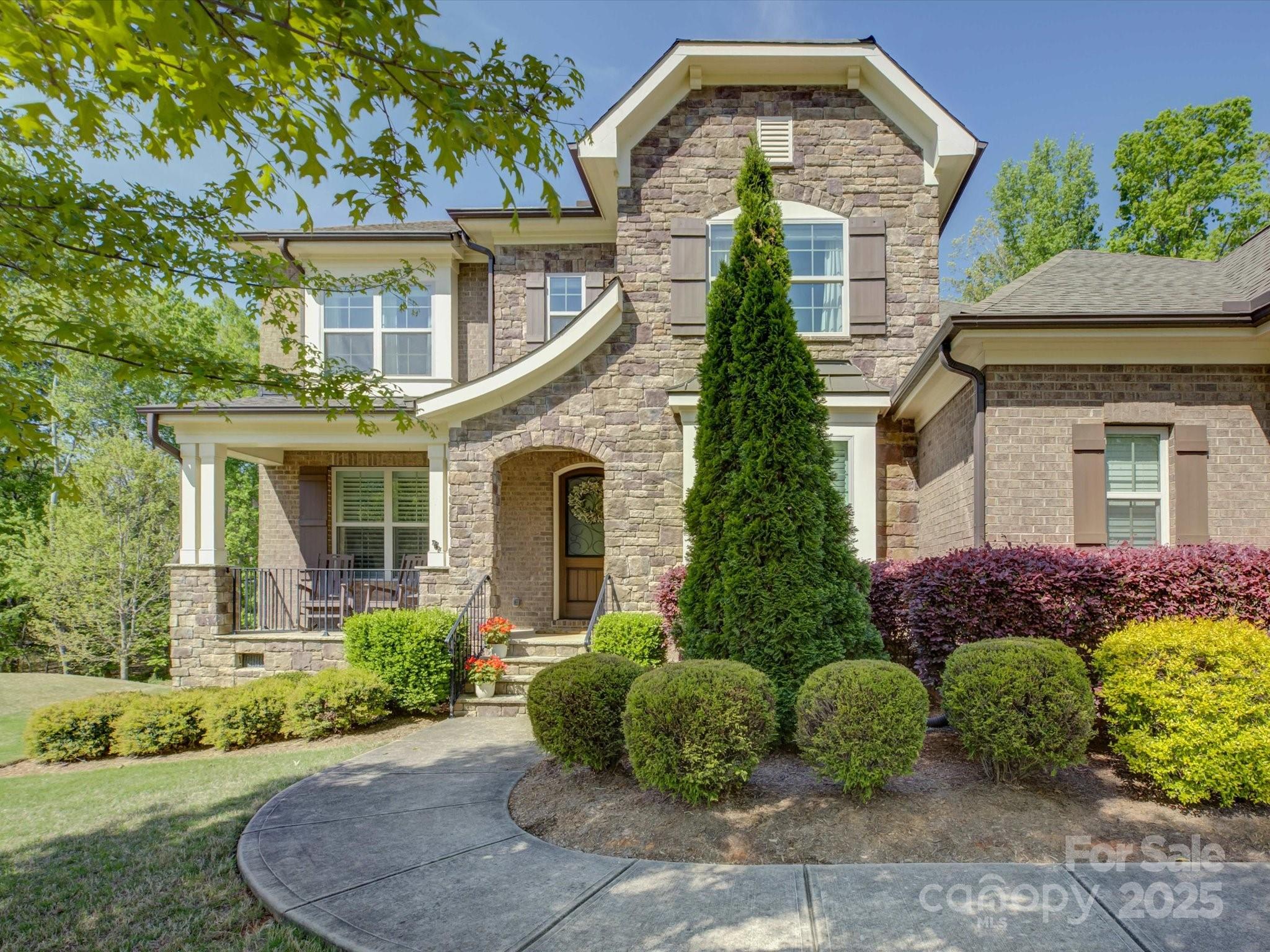 712 Chase Court Fort Mill, SC 29708 - Photo 2 of 48 a front view of a house with garden
