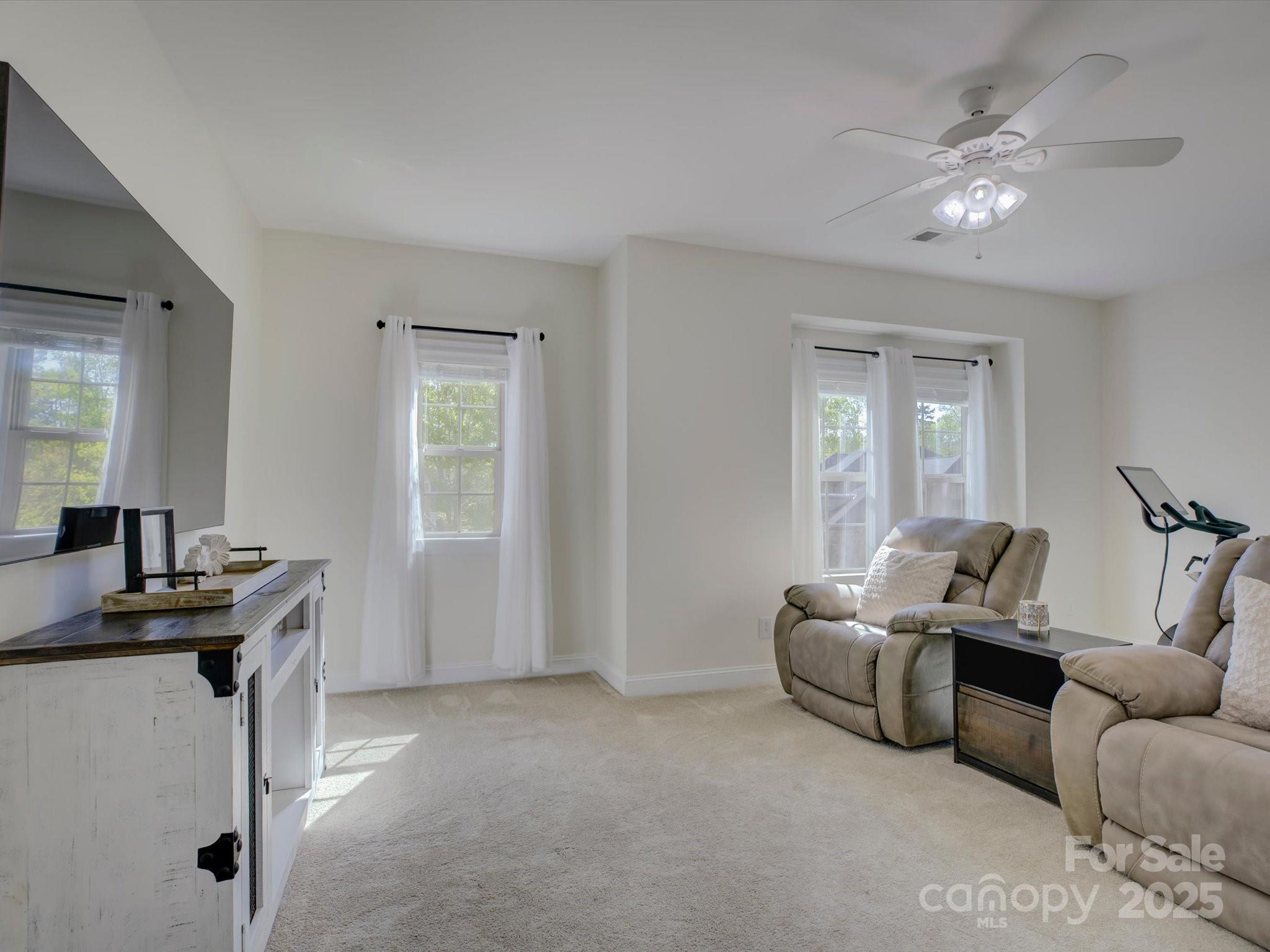712 Chase Court Fort Mill, SC 29708 - Photo 27 of 48 a living room with furniture and a chandelier