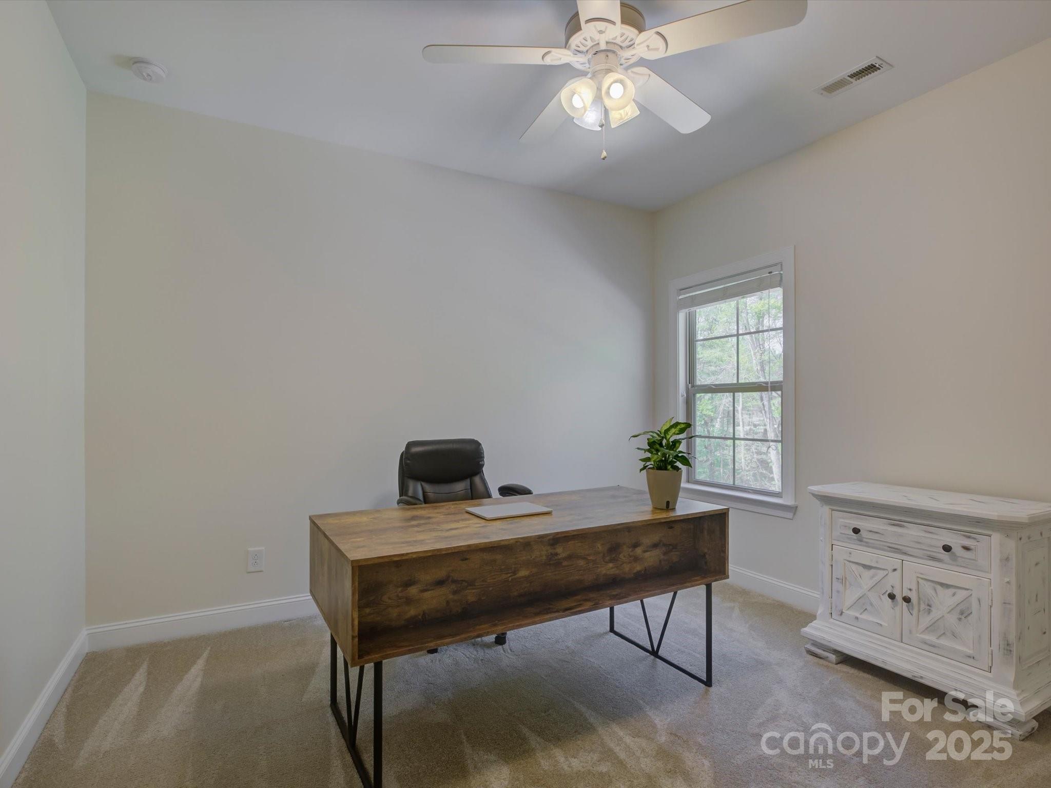 712 Chase Court Fort Mill, SC 29708 - Photo 30 of 48 a view of a workspace with furniture and a window