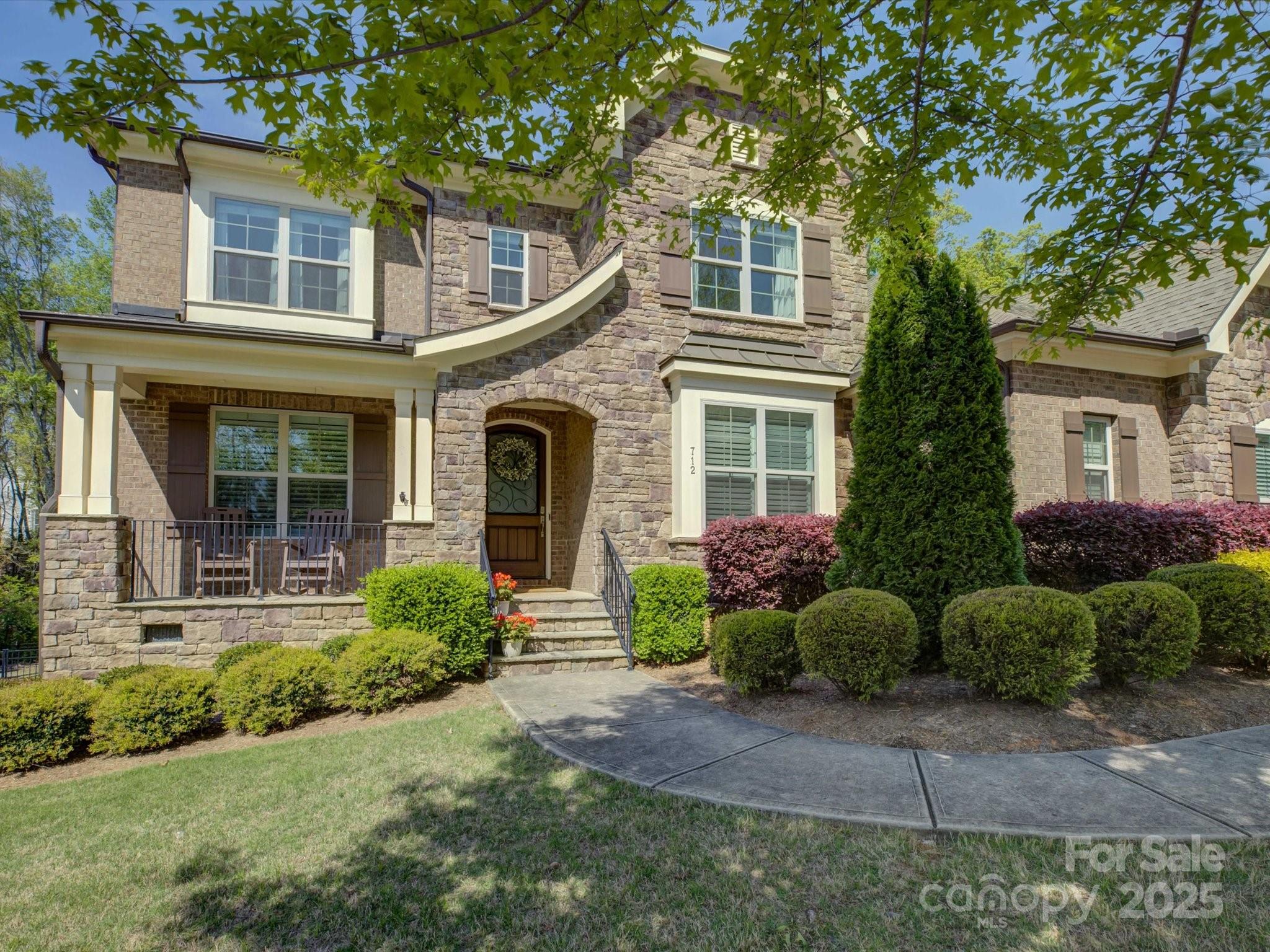 712 Chase Court Fort Mill, SC 29708 - Photo 3 of 48 a front view of a house with garden and plants