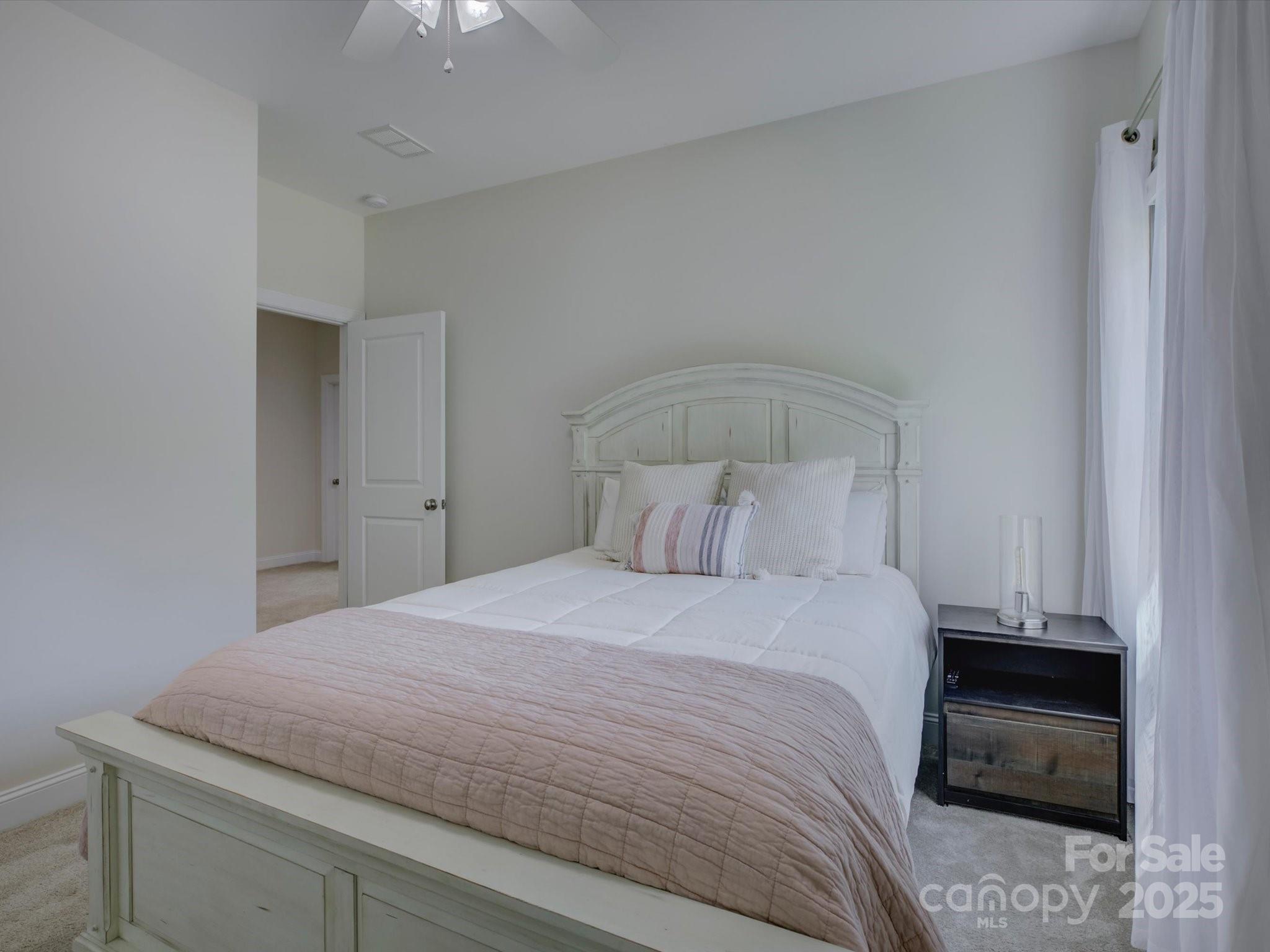 712 Chase Court Fort Mill, SC 29708 - Photo 33 of 48 a bedroom with a bed and a window