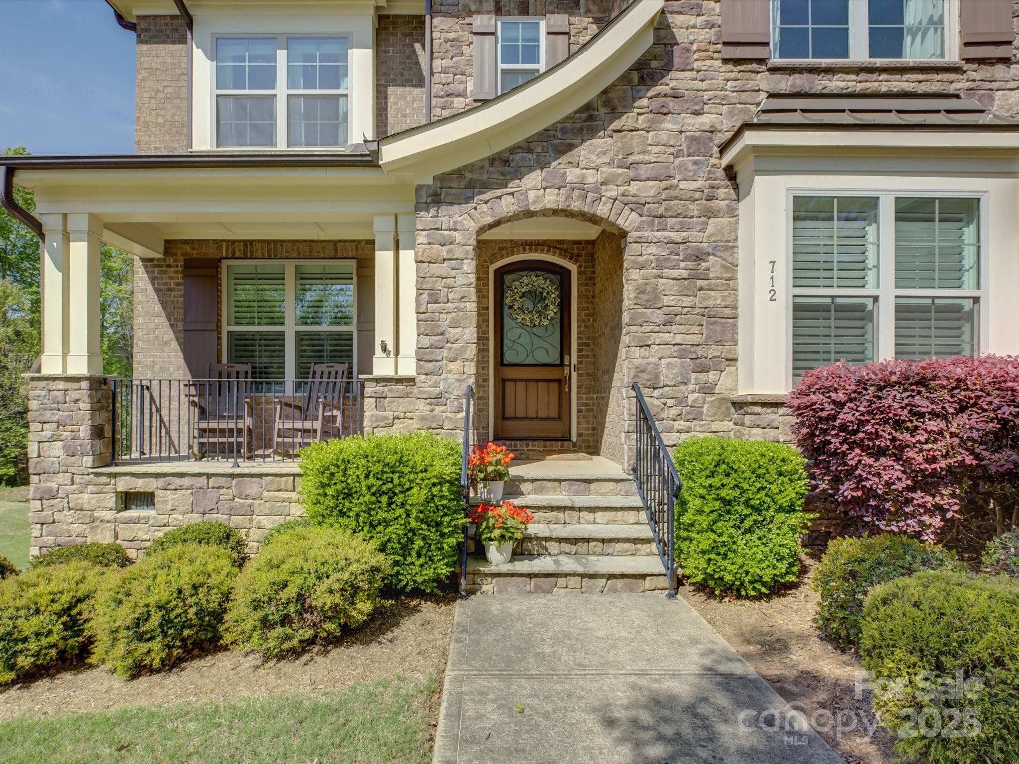 712 Chase Court Fort Mill, SC 29708 - Photo 4 of 48 front view of a house with a garden