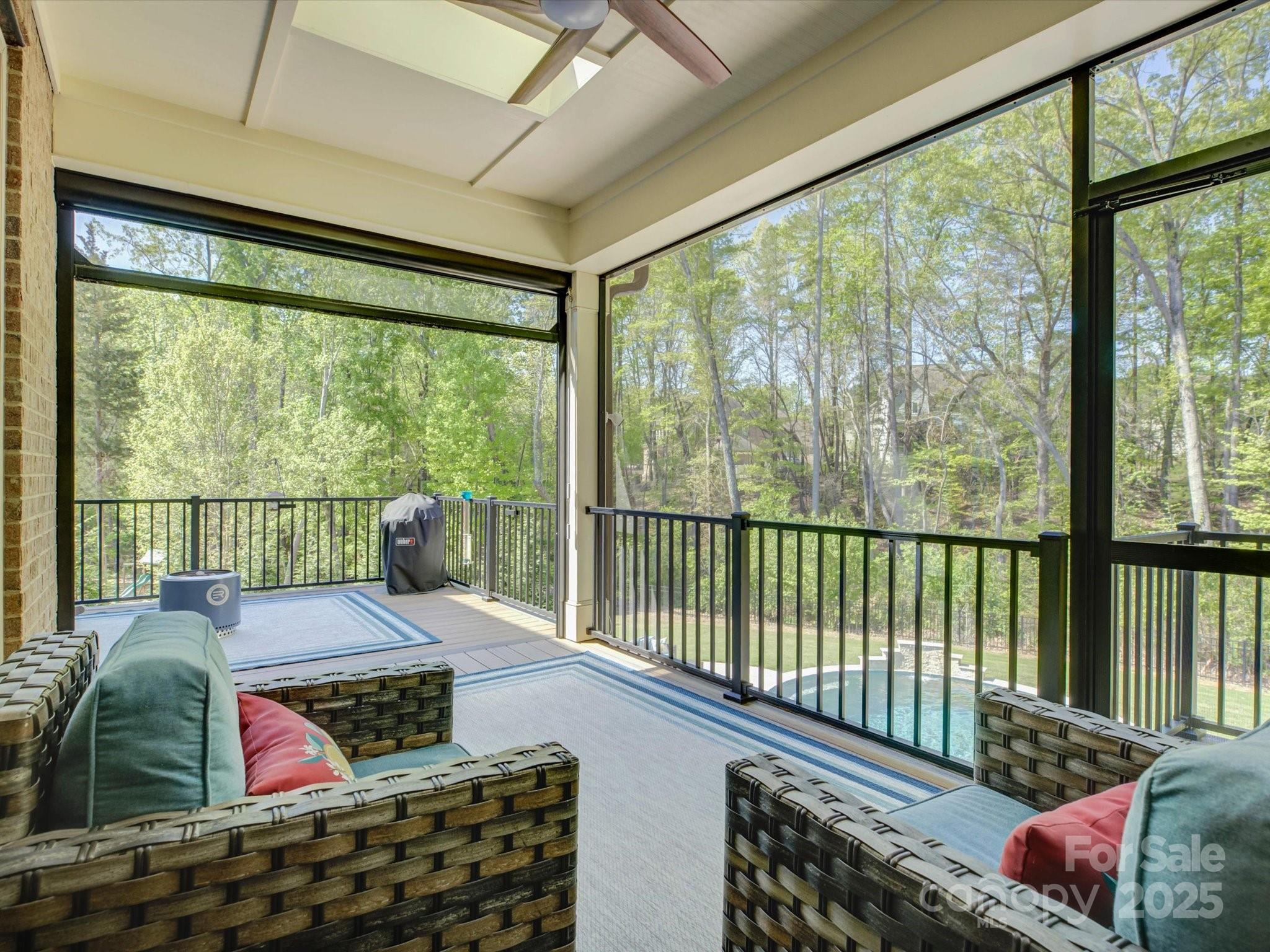 712 Chase Court Fort Mill, SC 29708 - Photo 46 of 48 a living room with furniture tv and a large window