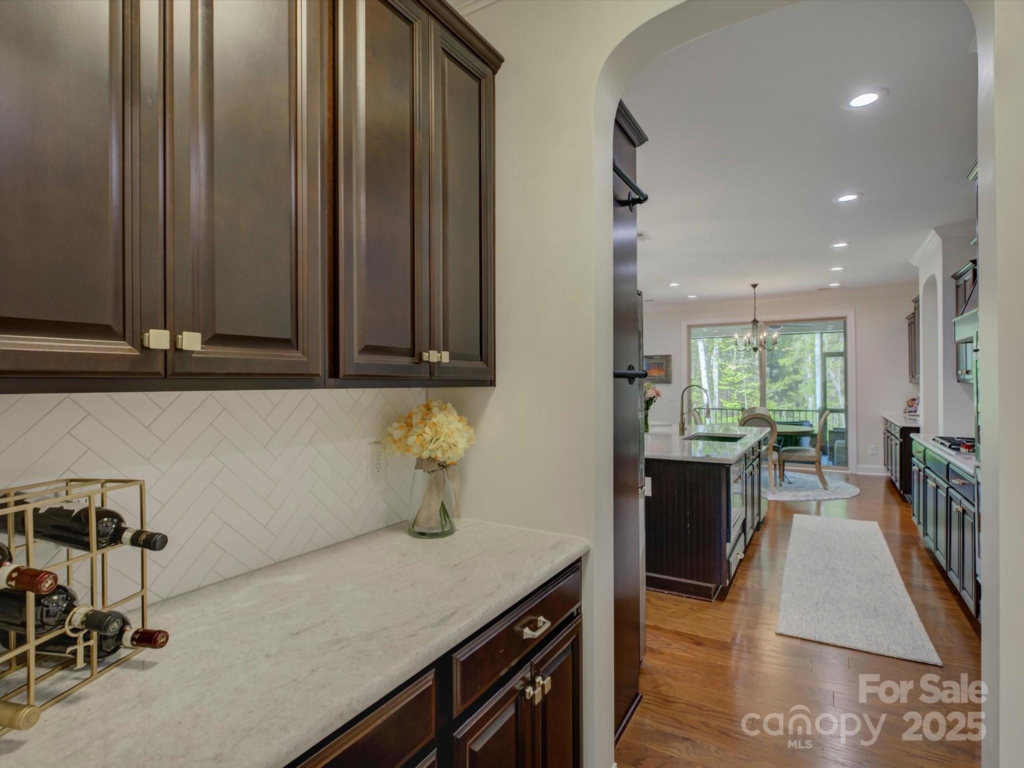 712 Chase Court Fort Mill, SC 29708 - Photo 10 of 48 a kitchen with granite countertop a stove a sink and a microwave