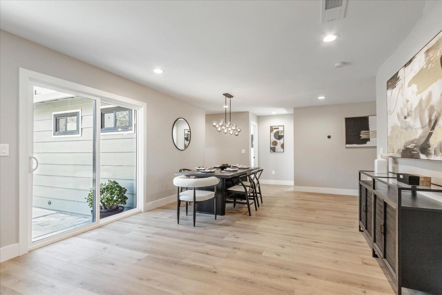 2575 Trimble Road San Jose, CA 95132 - Photo 15 of 74 a view of a dining room with furniture window and wooden floor