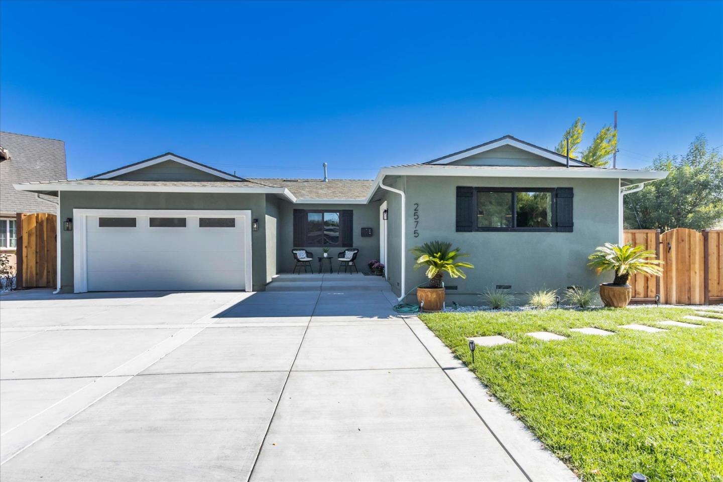 2575 Trimble Road San Jose, CA 95132 - Photo 2 of 74 a front view of a house with a yard
