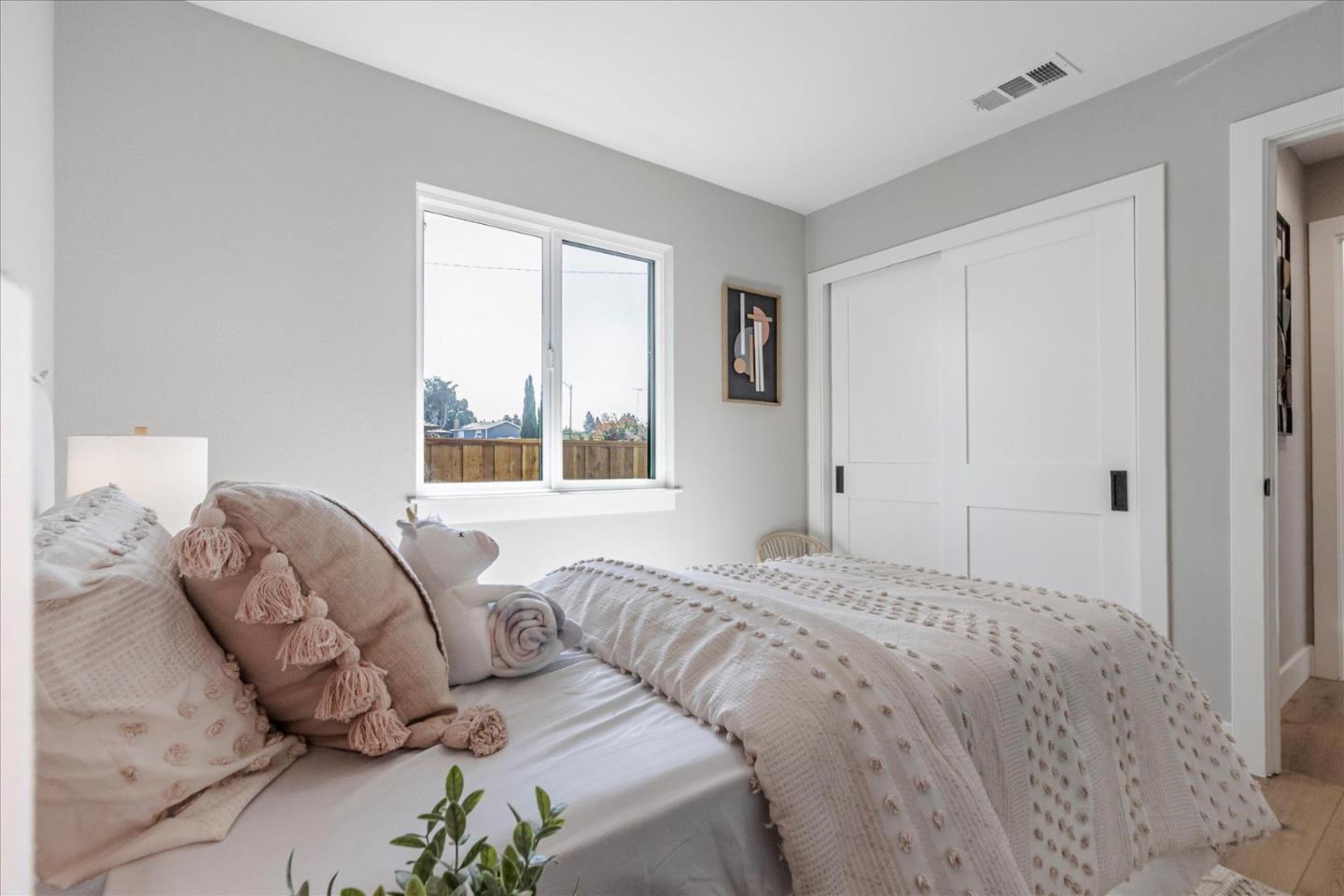 2575 Trimble Road San Jose, CA 95132 - Photo 22 of 74 a bedroom with a bed and a window