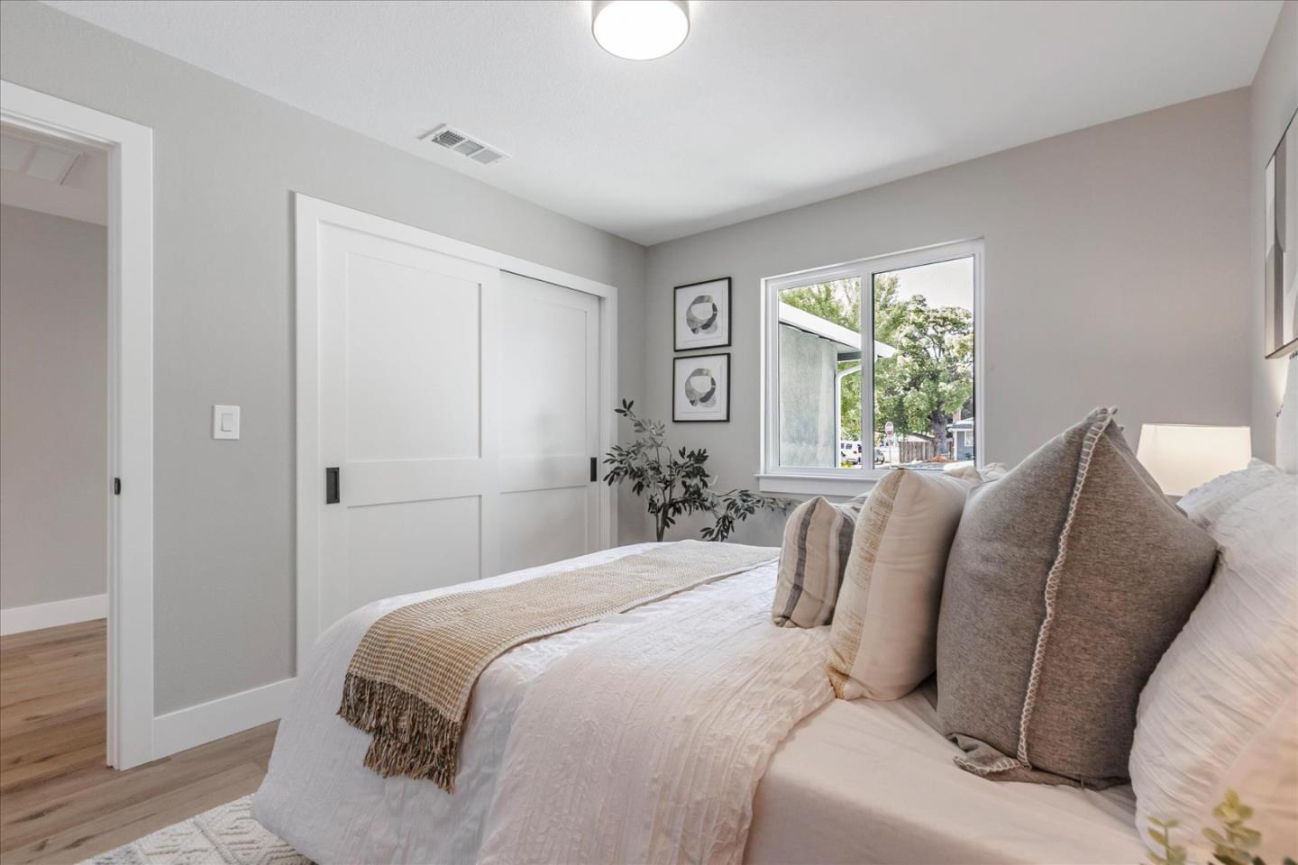 2575 Trimble Road San Jose, CA 95132 - Photo 25 of 74 a bedroom with a bed and a large window