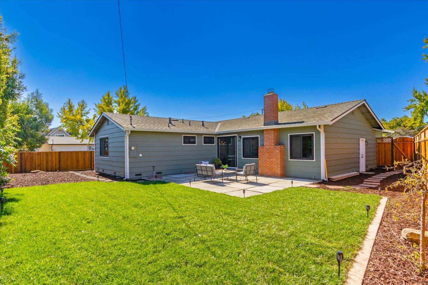2575 Trimble Road San Jose, CA 95132 - Photo 33 of 74 a view of a house with backyard and sitting area
