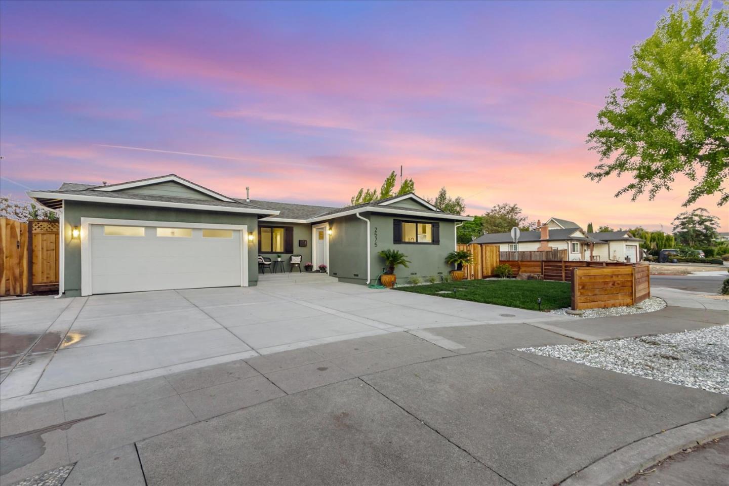 2575 Trimble Road San Jose, CA 95132 - Photo 34 of 74 a front view of a house with a yard and garage