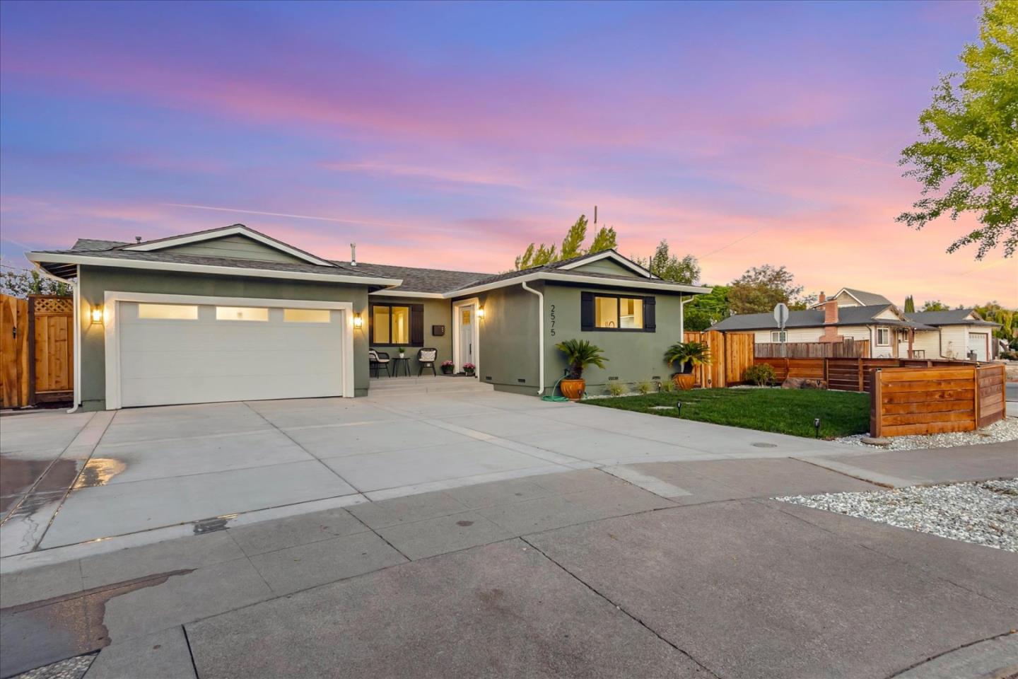 2575 Trimble Road San Jose, CA 95132 - Photo 35 of 74 a front view of a house with a yard and potted plants