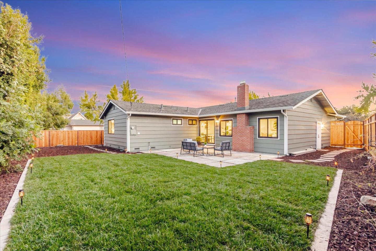 2575 Trimble Road San Jose, CA 95132 - Photo 39 of 74 a front view of a house with patio and garden