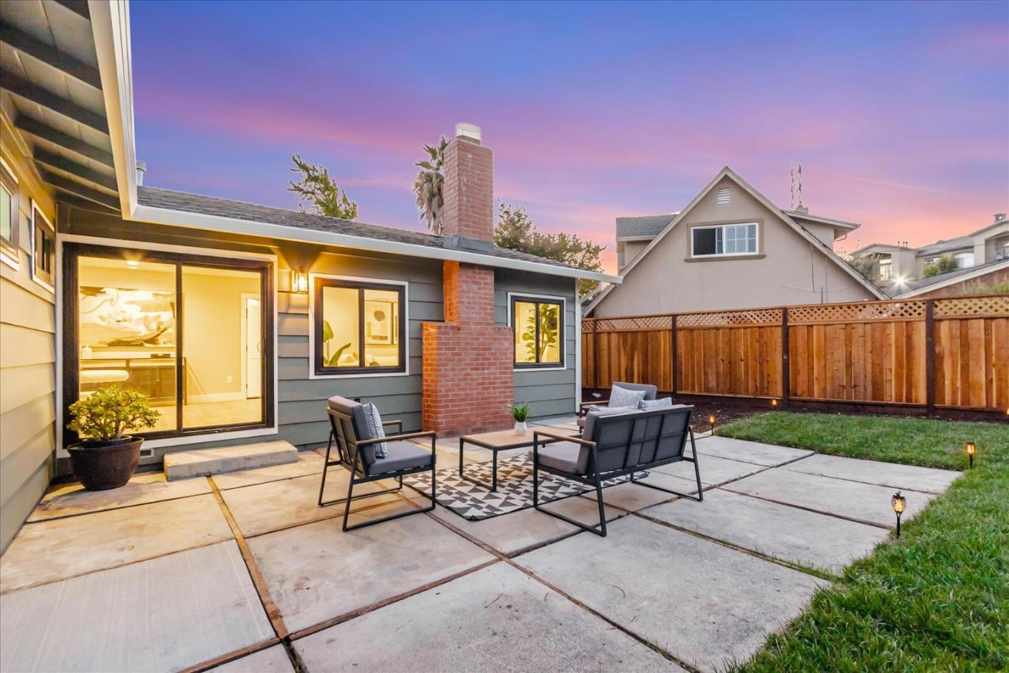 2575 Trimble Road San Jose, CA 95132 - Photo 41 of 74 a backyard of a house with barbeque oven table and chairs