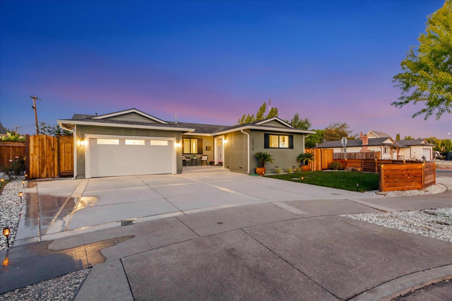 2575 Trimble Road San Jose, CA 95132 - Photo 46 of 74 a front view of a house with a yard and garage