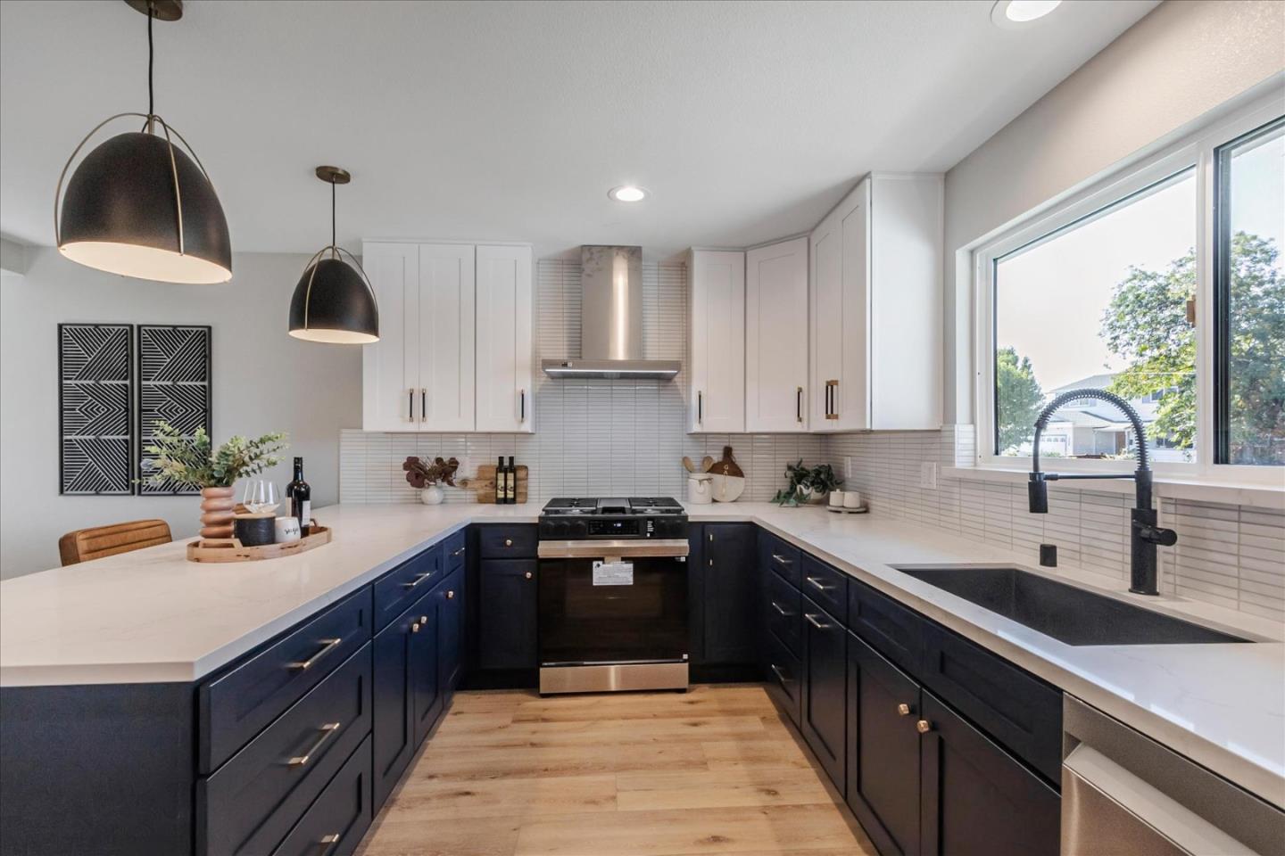 2575 Trimble Road San Jose, CA 95132 - Photo 9 of 74 a kitchen with a sink a stove and cabinets