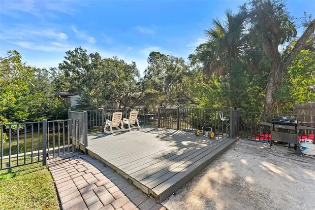 a view of a chairs and table on the deck
