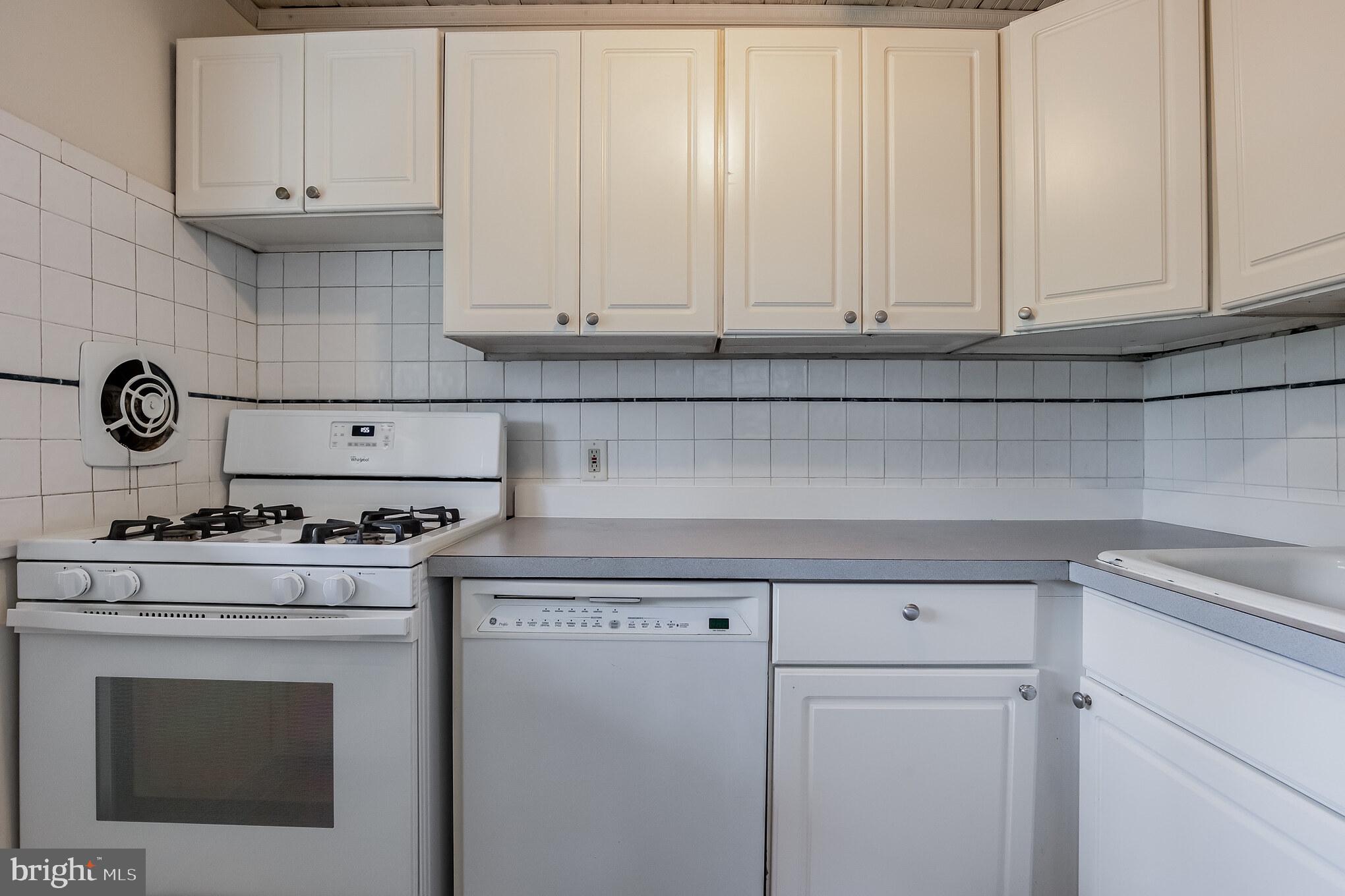 58 Eastwood Road Berwyn, PA 19312 - Photo 10 of 35 Kitchen With White Cabinetry Tile Backsplash
