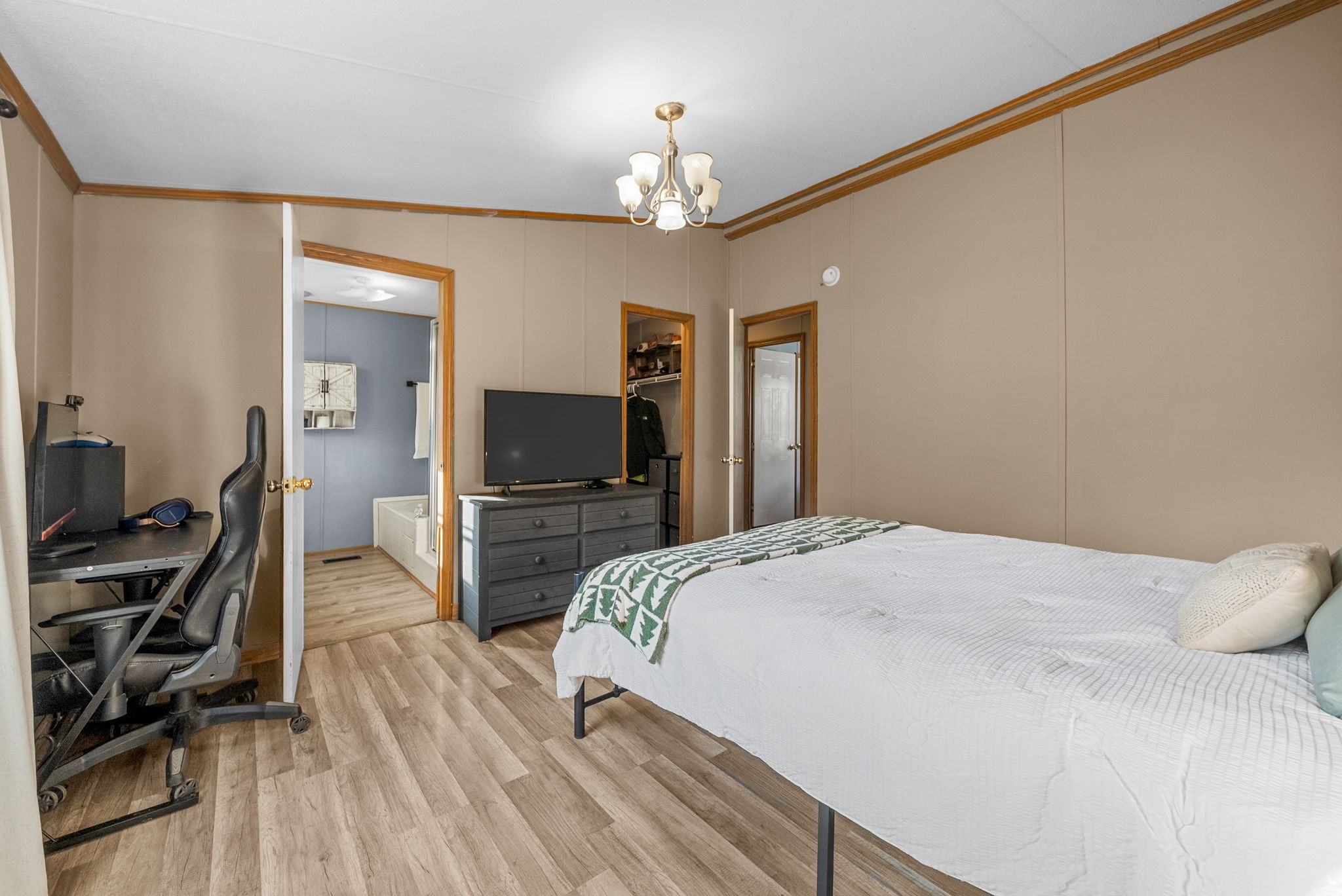 1196 Pickle Knight Road Joelton, TN 37080 - Photo 13 of 32 a bedroom with a bed and a flat tv screen on a dresser