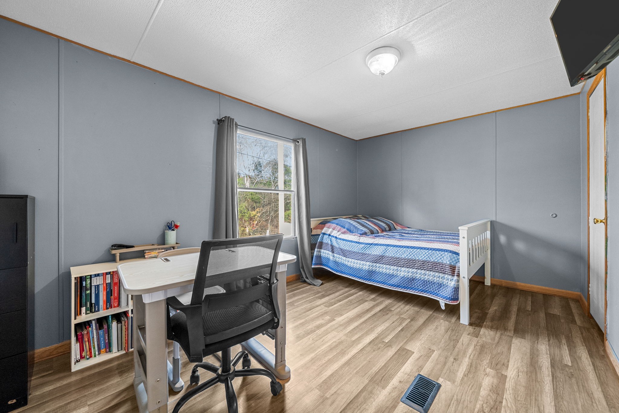 1196 Pickle Knight Road Joelton, TN 37080 - Photo 17 of 32 a bedroom with a bed and a book shelf