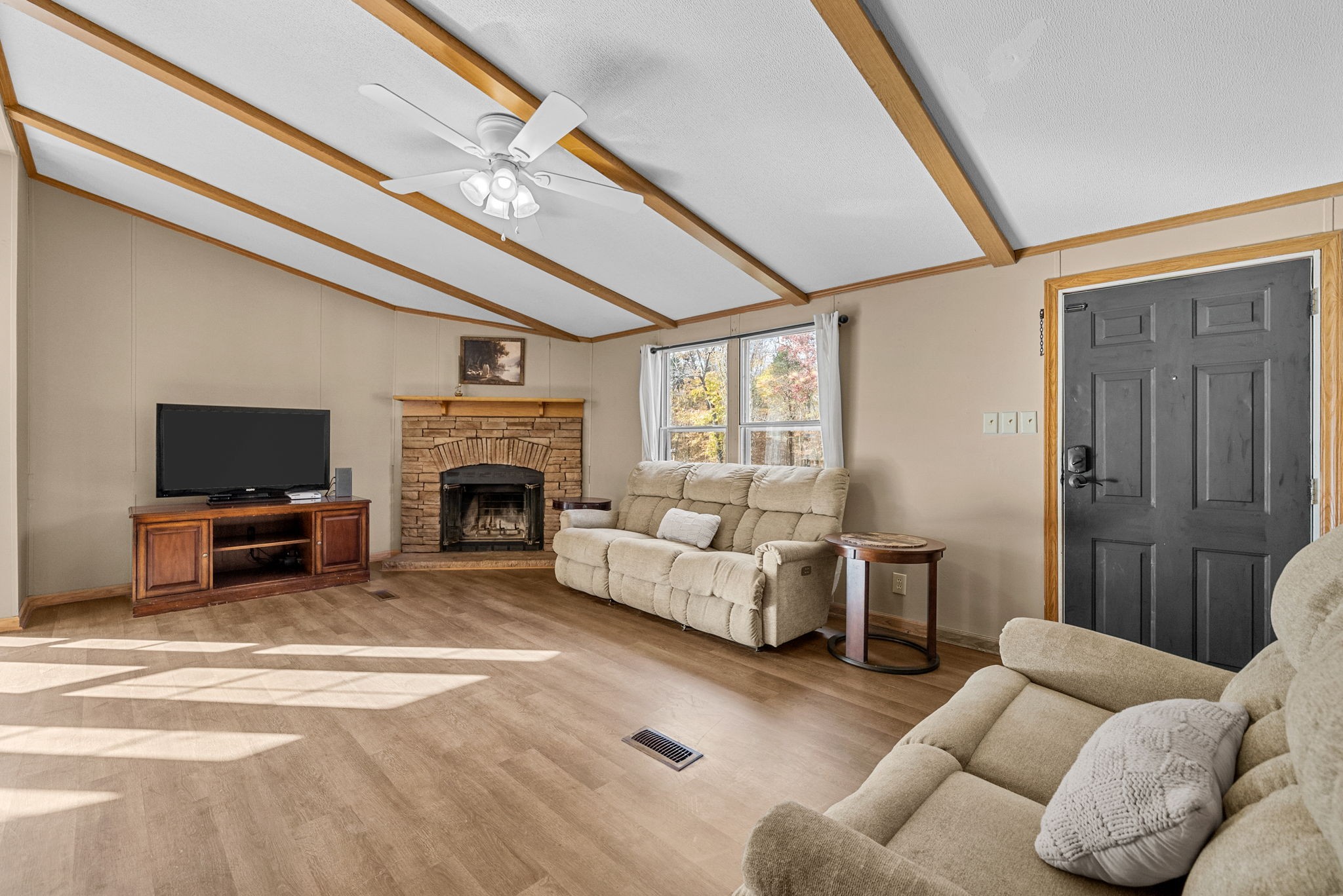 1196 Pickle Knight Road Joelton, TN 37080 - Photo 2 of 32 a living room with furniture a flat screen tv and a fireplace
