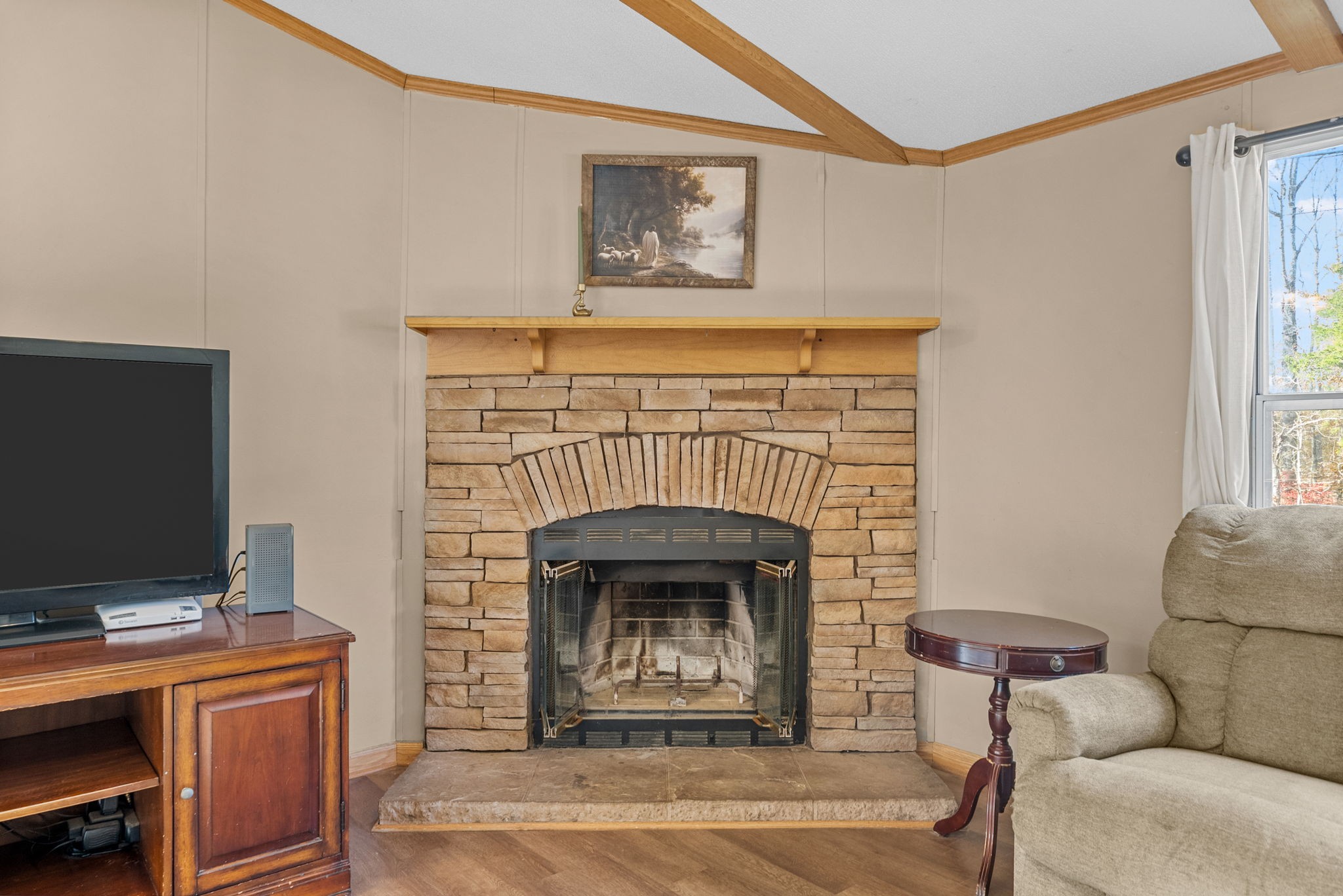 1196 Pickle Knight Road Joelton, TN 37080 - Photo 3 of 32 a living room with furniture a flat screen tv and a fireplace