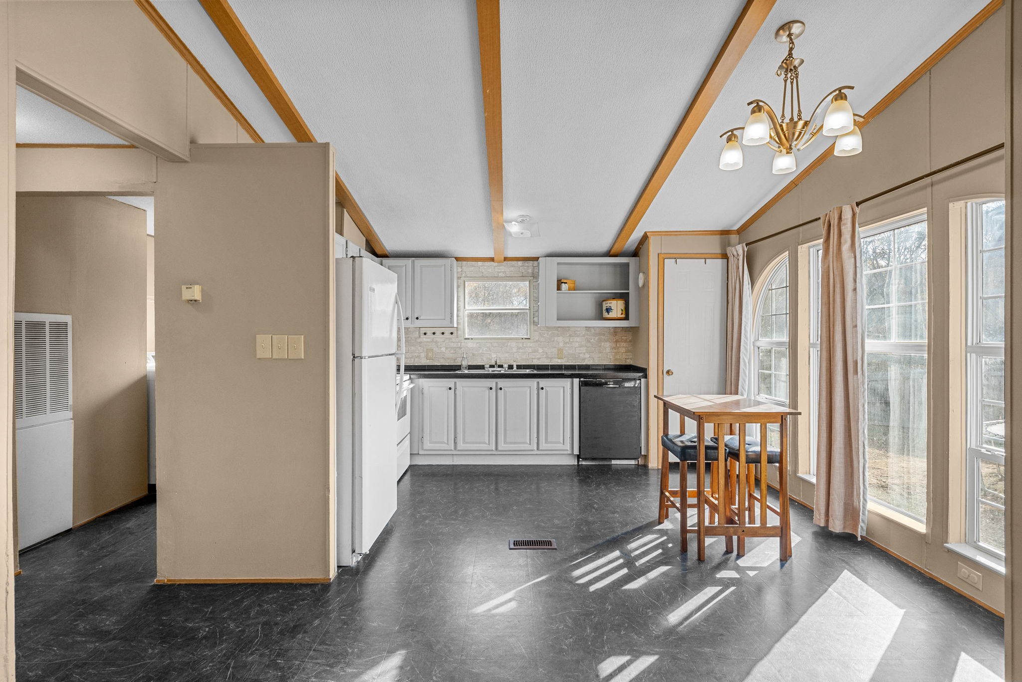 1196 Pickle Knight Road Joelton, TN 37080 - Photo 6 of 32 a open kitchen with granite countertop a refrigerator and a sink