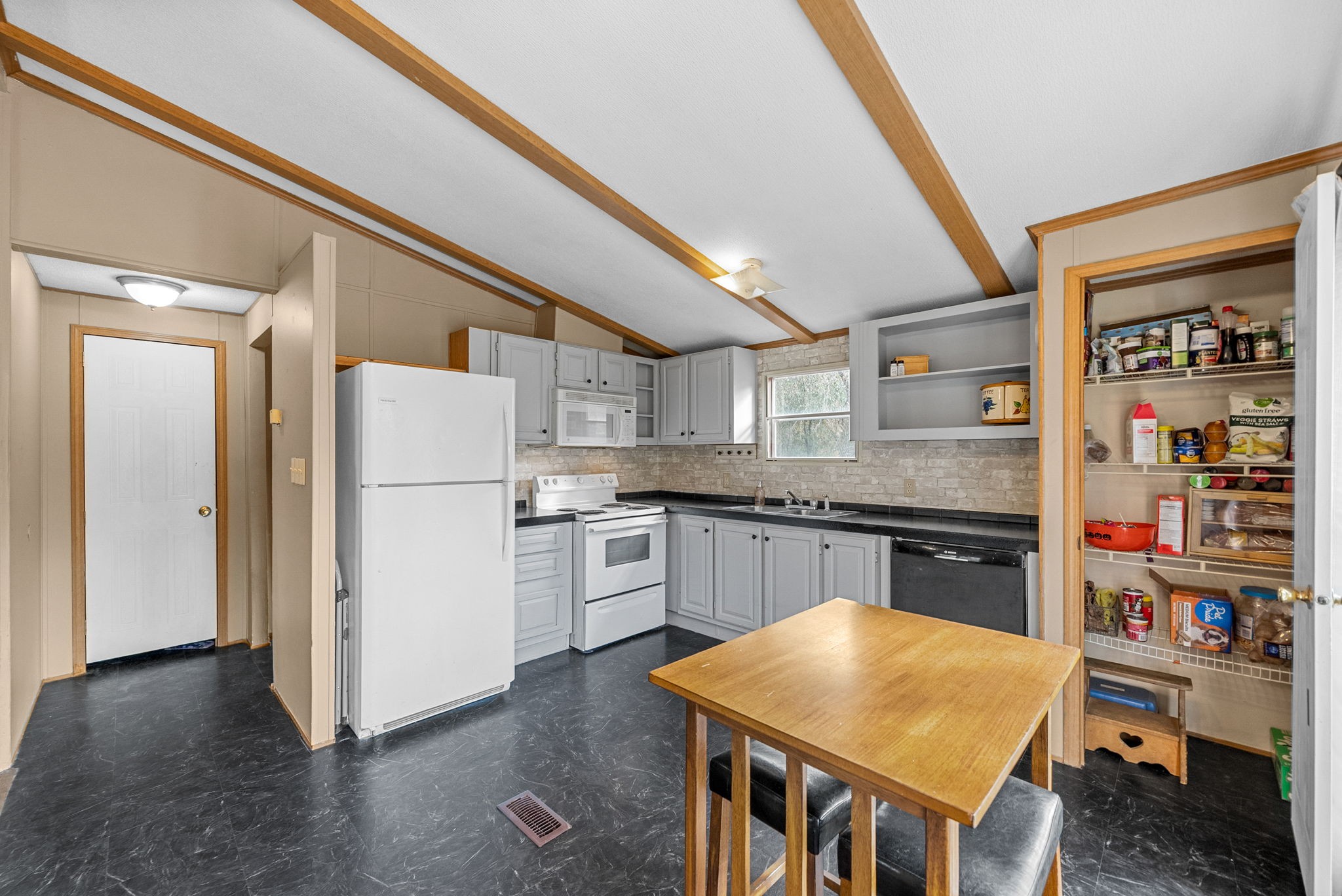 1196 Pickle Knight Road Joelton, TN 37080 - Photo 8 of 32 a kitchen with refrigerator and wooden floor