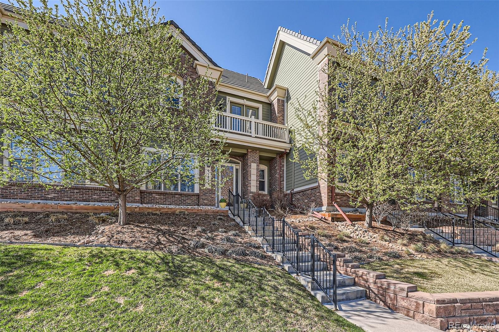 9182 Ridgegate Parkway Lone Tree, CO 80124 - Photo 2 of 31 a front view of a house with a yard
