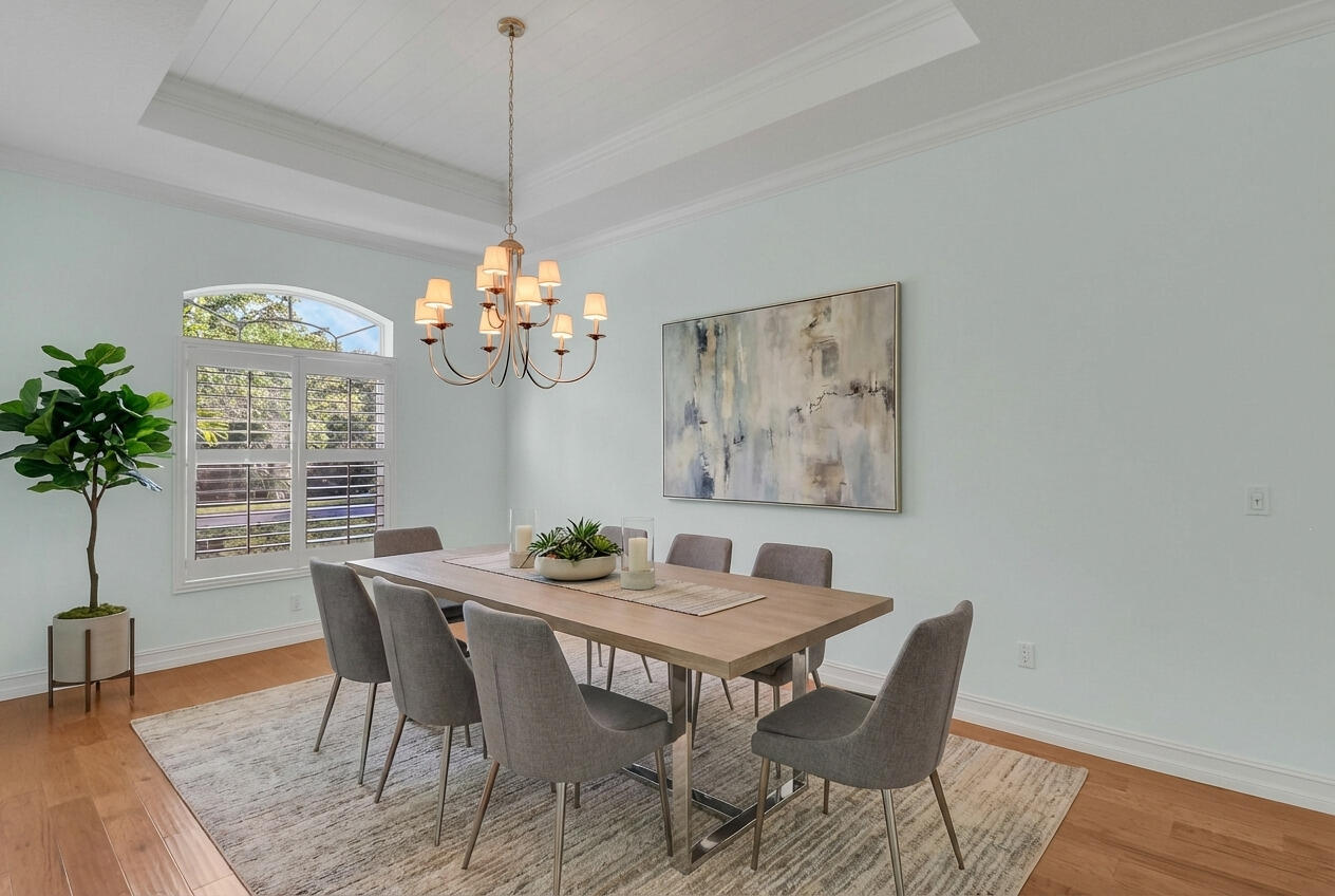 8415 Southeast Governors Way Hobe Sound, FL 33455 - Photo 18 of 105 a view of a dining room with furniture wooden floor and chandelier