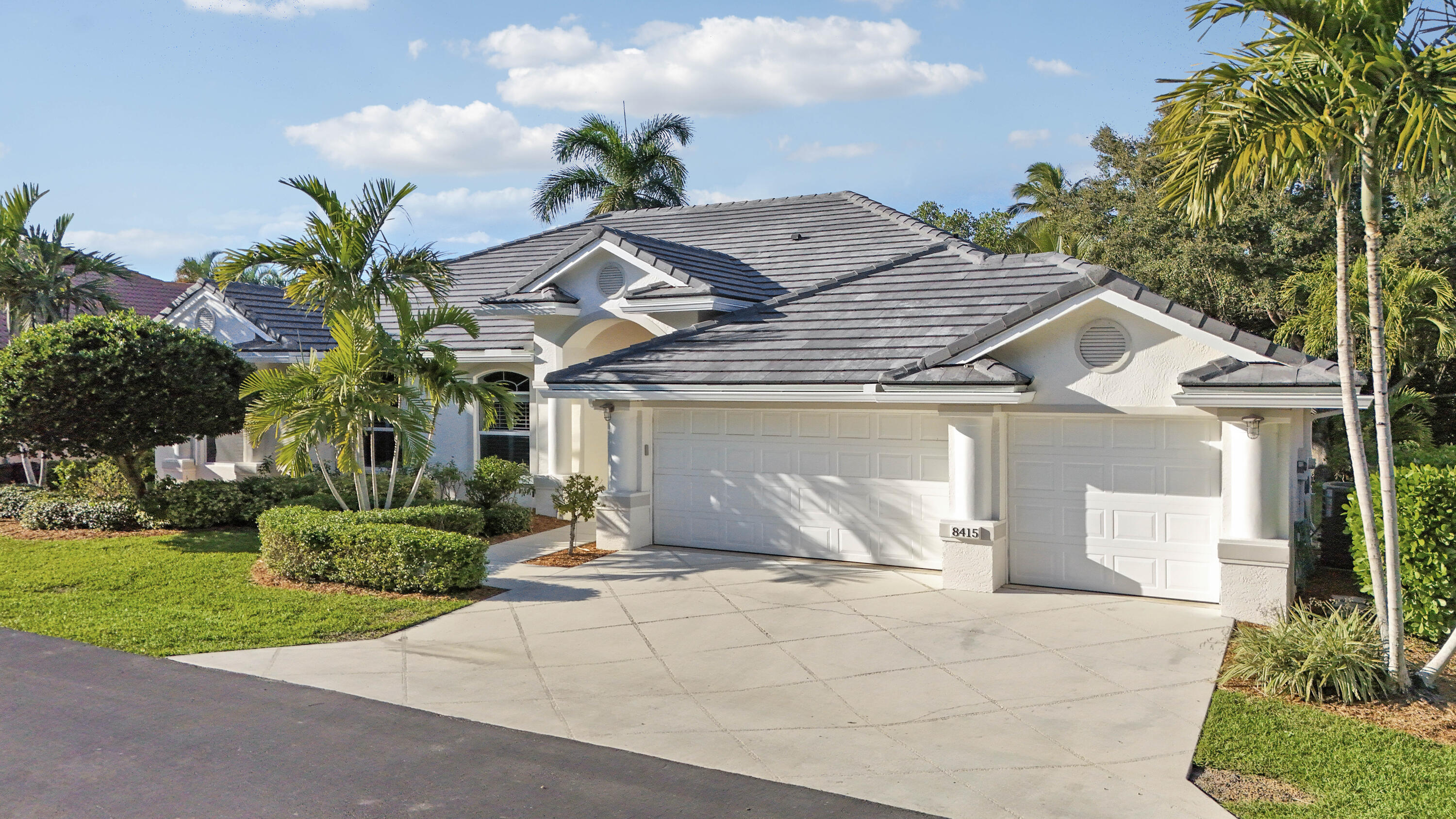 8415 Southeast Governors Way Hobe Sound, FL 33455 - Photo 2 of 105 a view of a house with a yard and potted plants