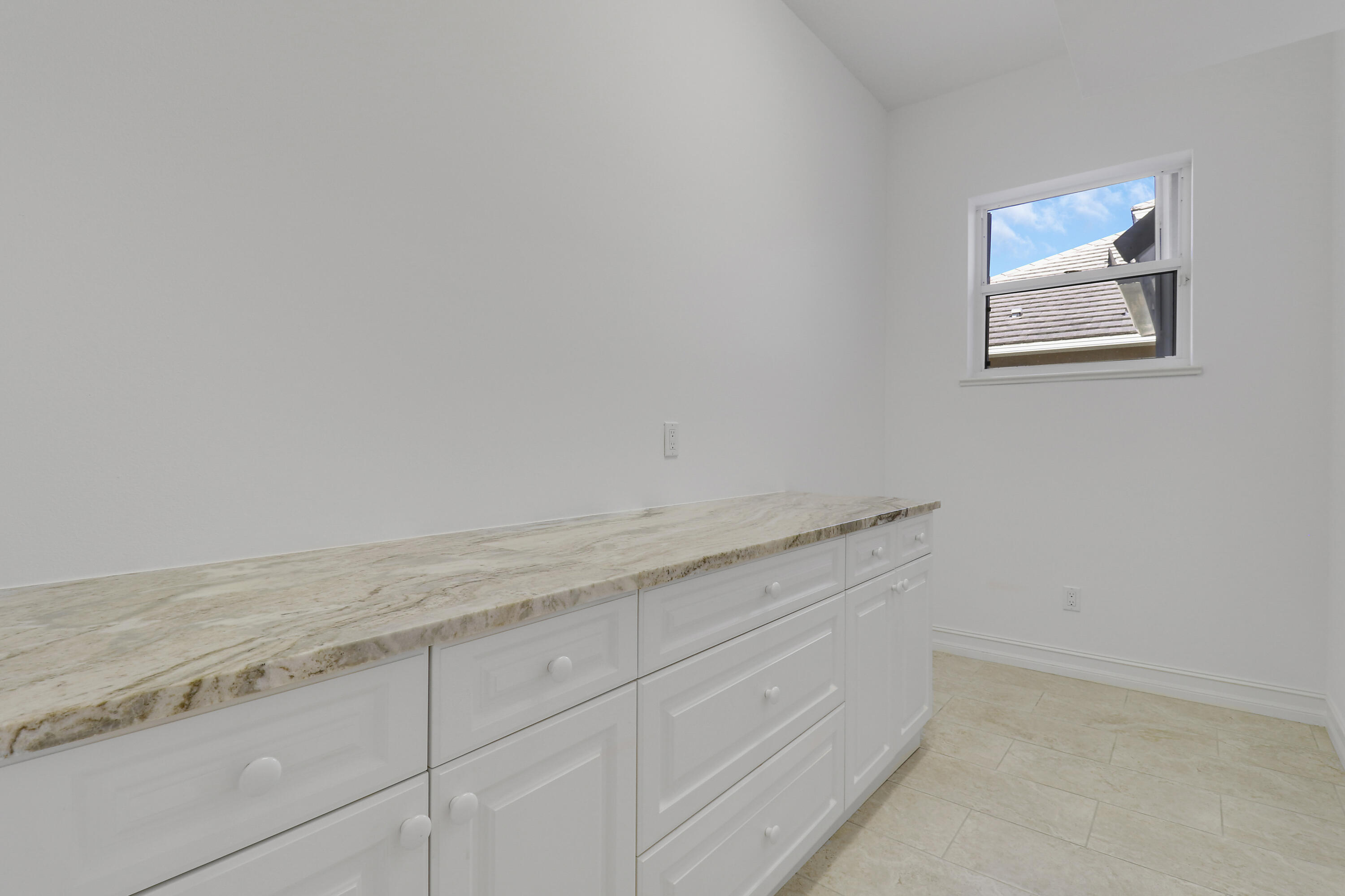 8415 Southeast Governors Way Hobe Sound, FL 33455 - Photo 32 of 105 a view of cabinets and wooden floor