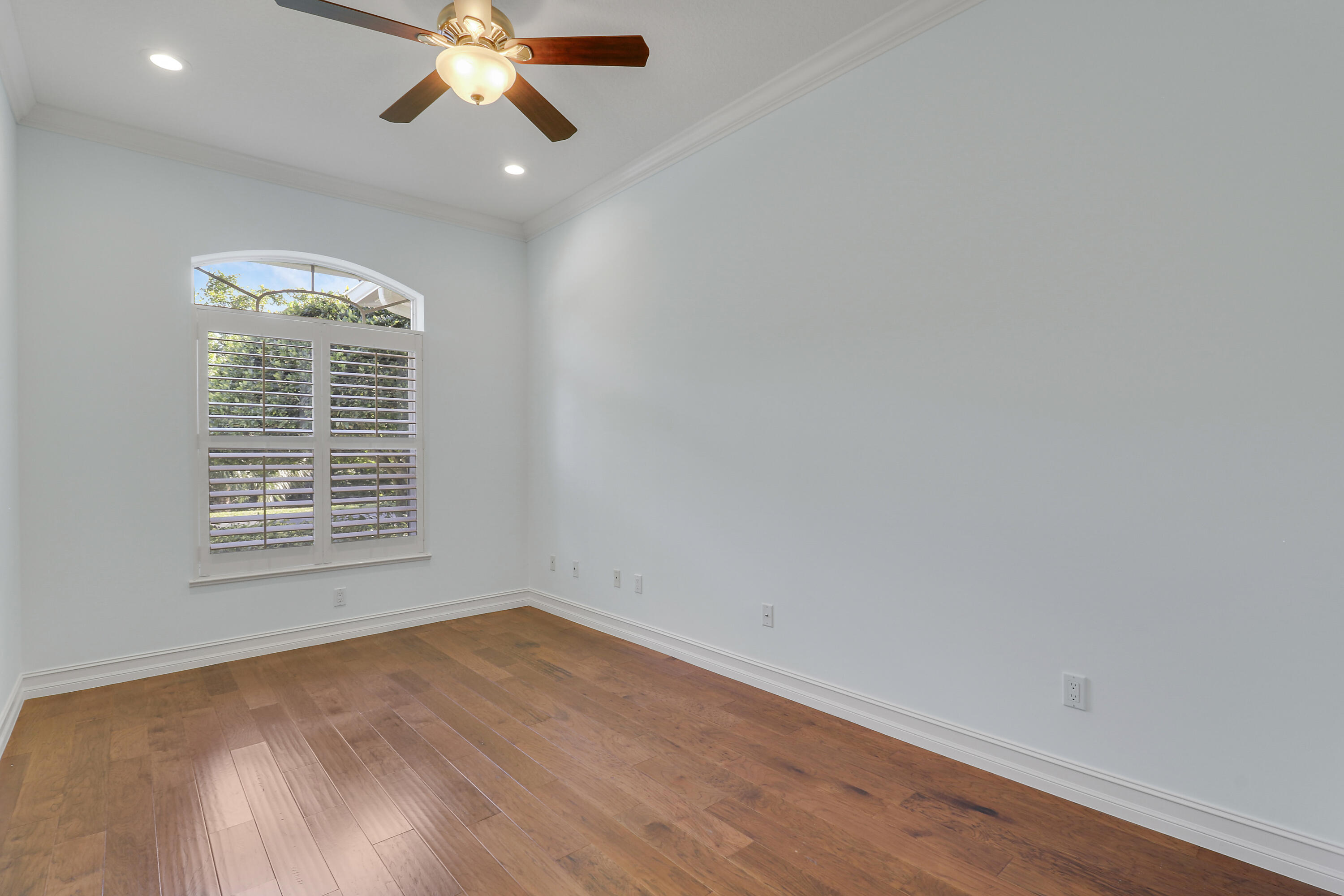 8415 Southeast Governors Way Hobe Sound, FL 33455 - Photo 33 of 105 an empty room with a window and a fan