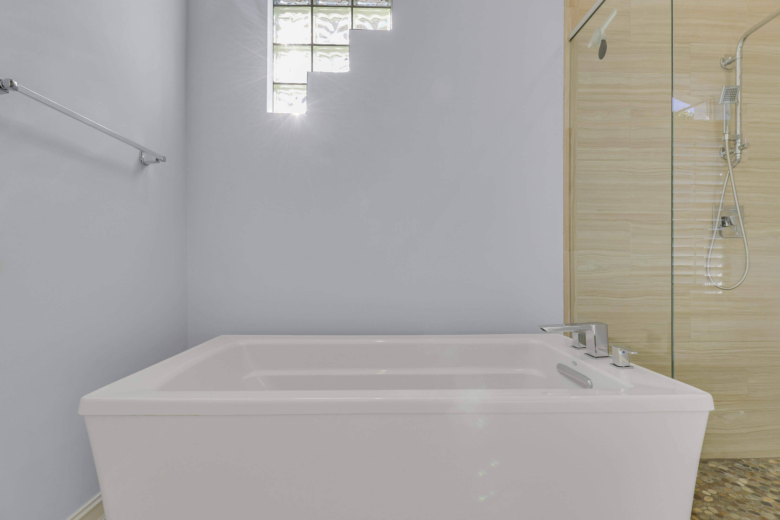 8415 Southeast Governors Way Hobe Sound, FL 33455 - Photo 42 of 105 a white bath tub sitting in a bathroom