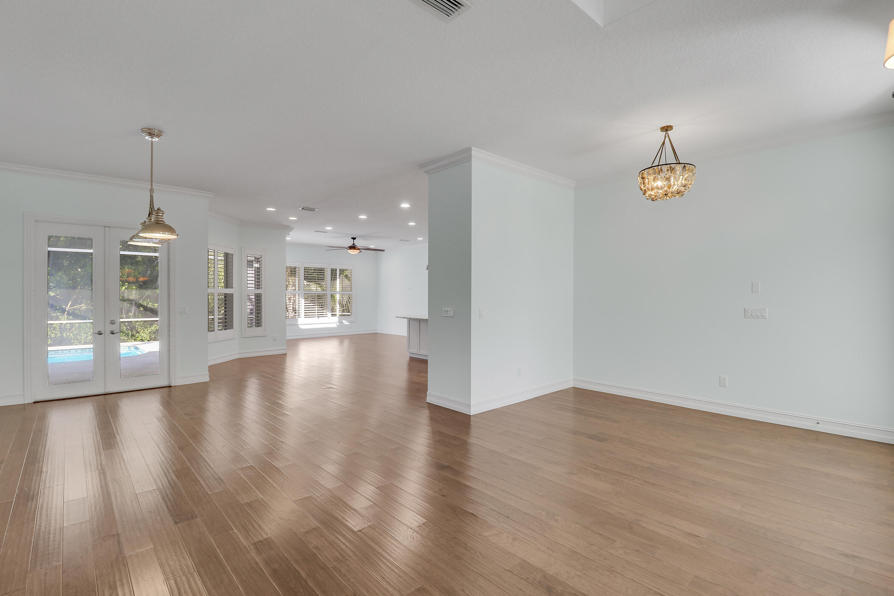 8415 Southeast Governors Way Hobe Sound, FL 33455 - Photo 50 of 105 a view of an empty room with wooden floor and a window