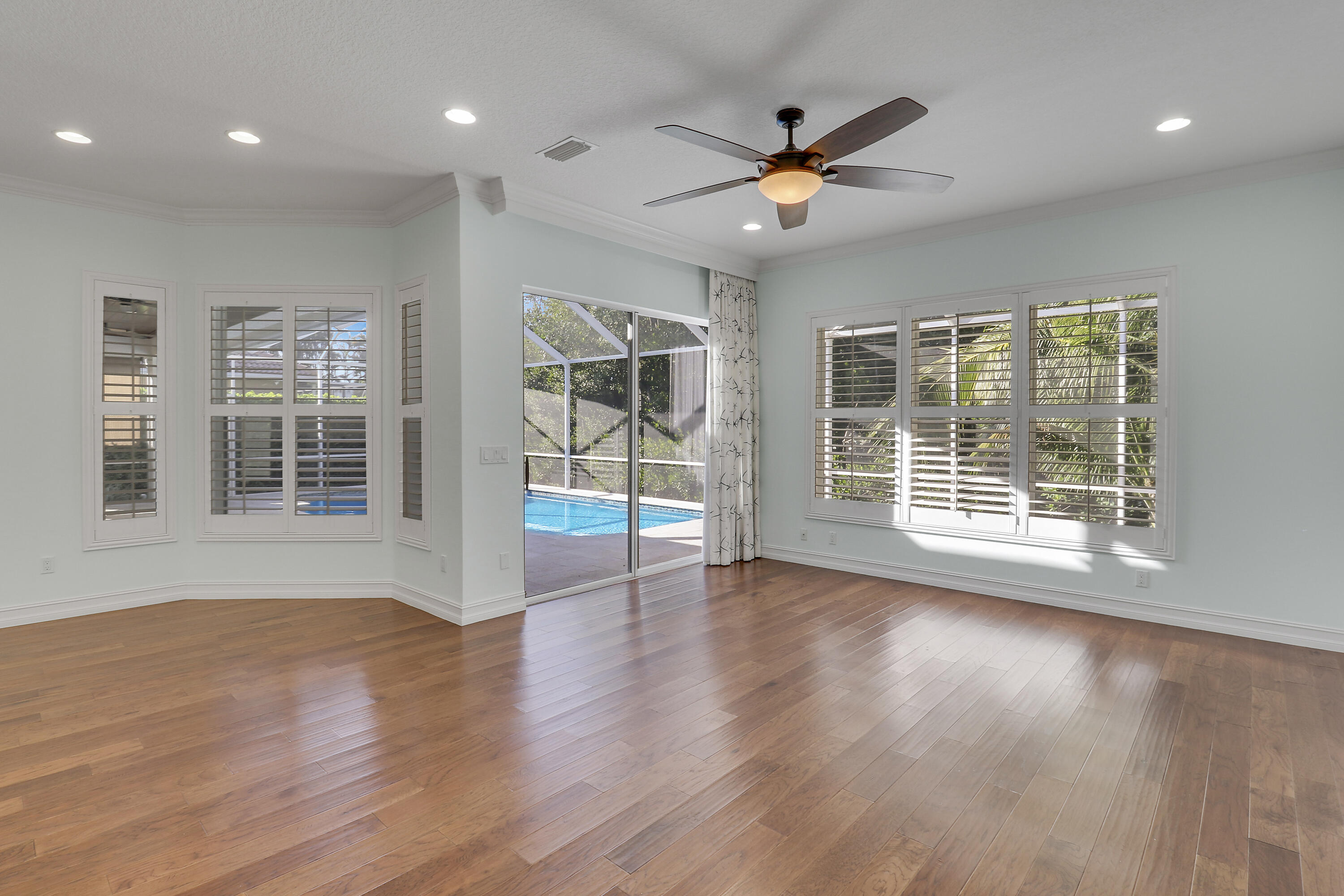 8415 Southeast Governors Way Hobe Sound, FL 33455 - Photo 56 of 105 a view of an empty room with wooden floor and a window