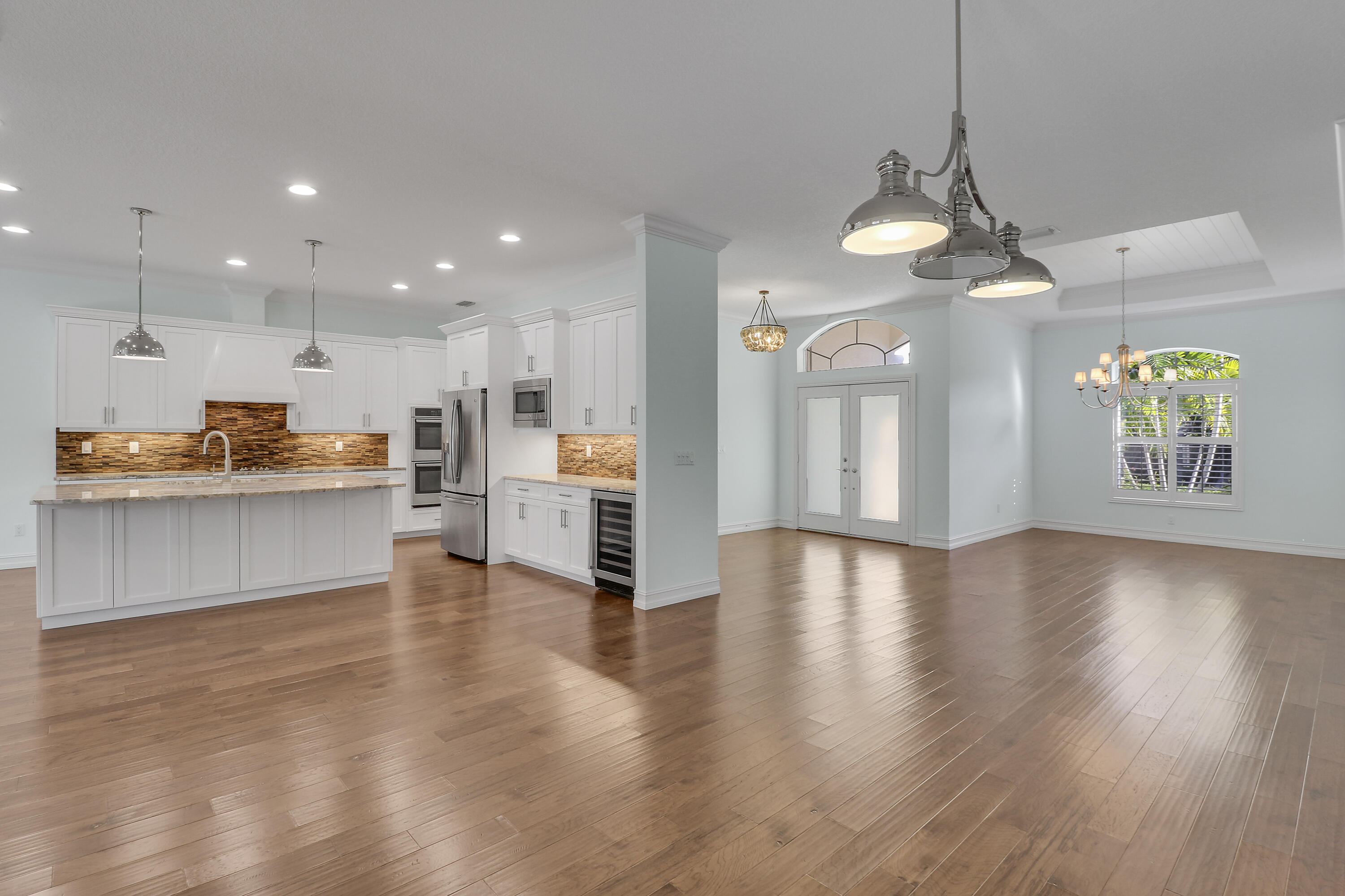 8415 Southeast Governors Way Hobe Sound, FL 33455 - Photo 7 of 105 a view of a kitchen with a sink and a stove top oven