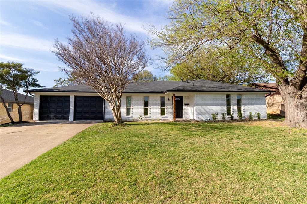 6192 Wrigley Way Fort Worth, TX 76133 - Photo 1 of 26 View of front facade with brick siding, driveway, a garage, and a front lawn