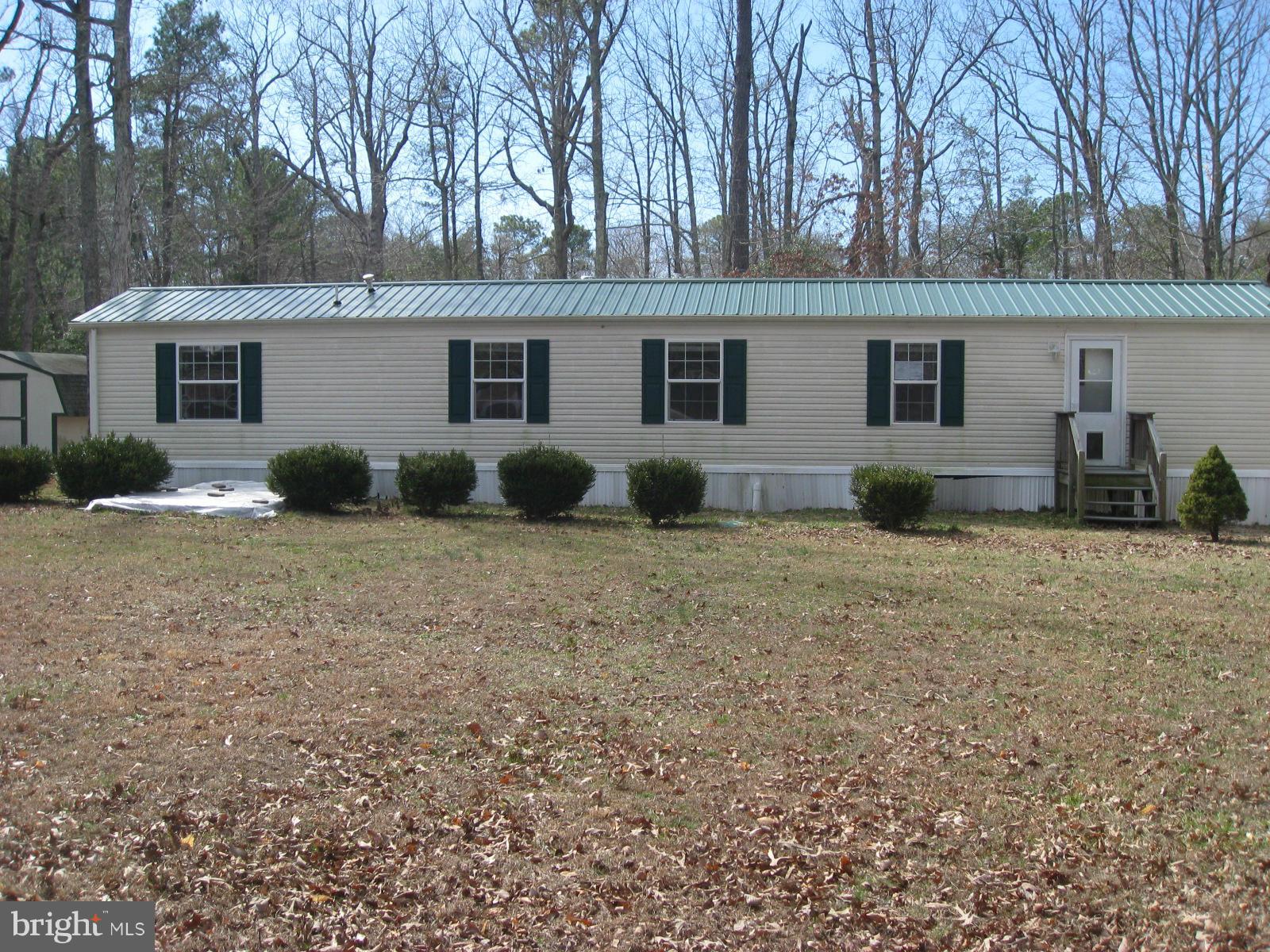 18109 Three Notch Road Lexington Park, MD 20653 - Photo 1 of 6 a view of house with backyard and trees