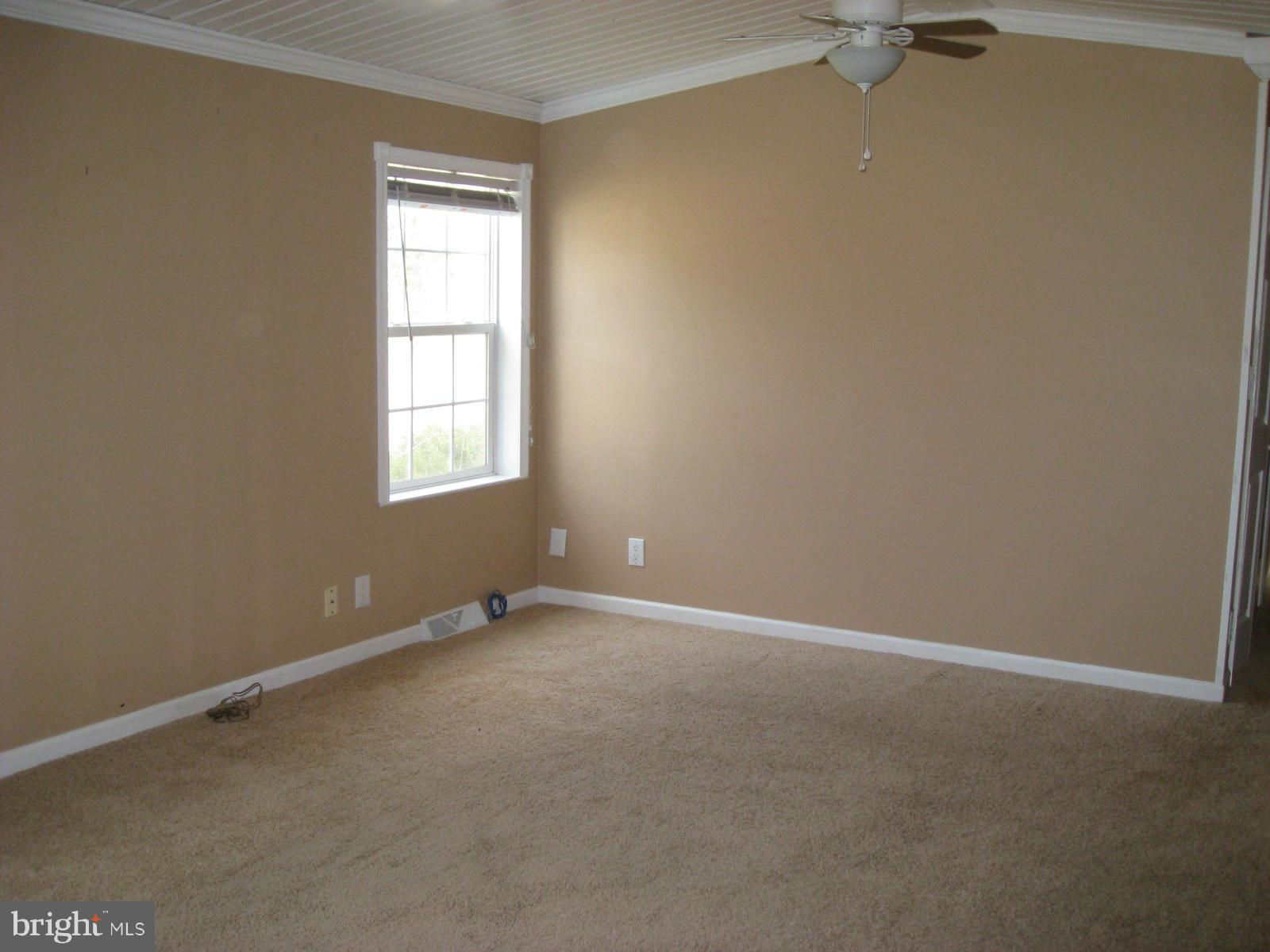 18109 Three Notch Road Lexington Park, MD 20653 - Photo 4 of 6 an empty room with a window